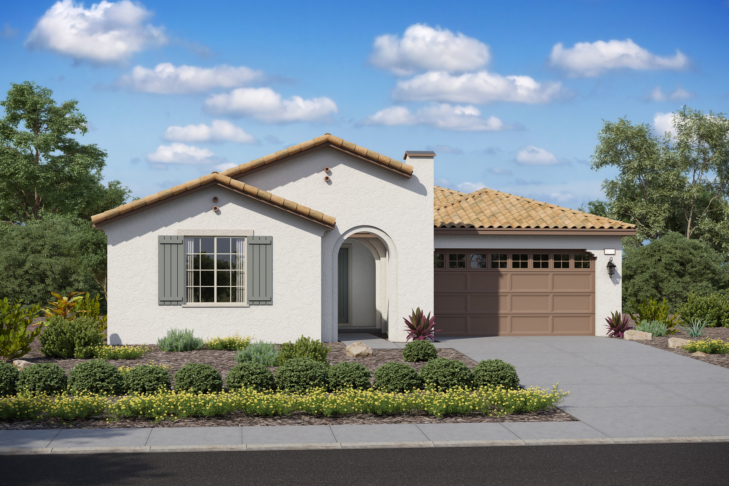 A single-story Mediterranean-style house with a tiled roof, surrounded by a well-manicured garden and set against a backdrop of a blue sky with fluffy white clouds.