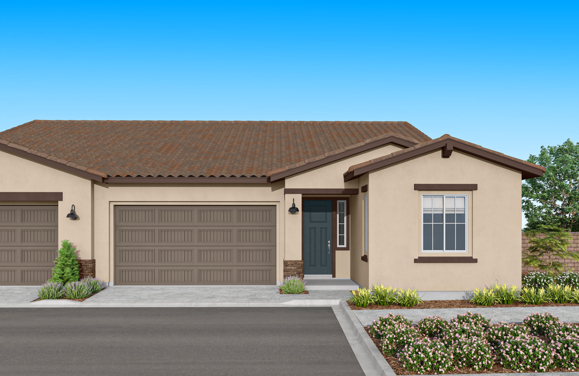 A single-story house with a brown tile roof, beige exterior walls, and a two-car garage stands in a well-landscaped yard with shrubs and trees in the foreground against a clear blue sky.