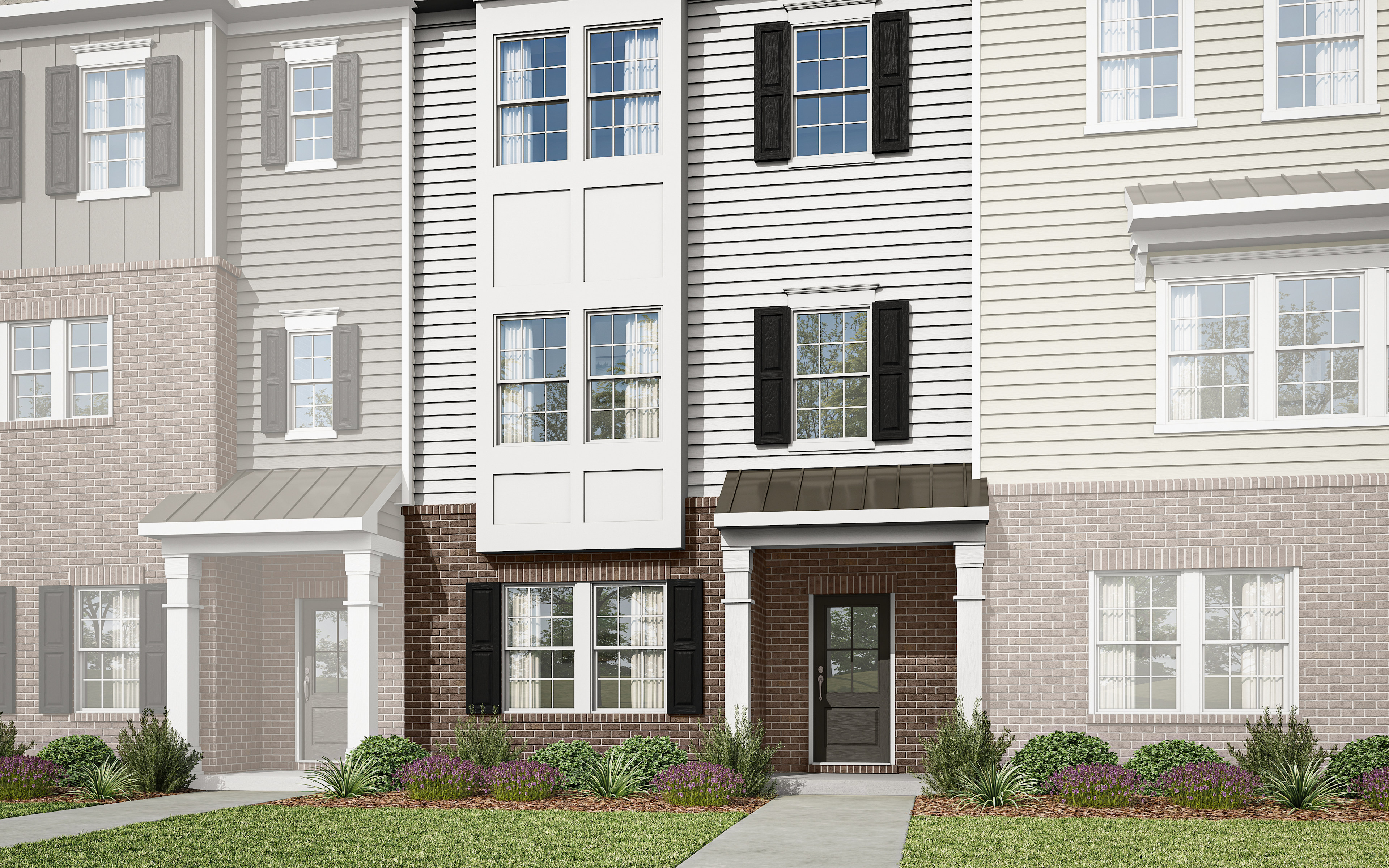 A multi-story townhouse with a brick and siding exterior, surrounded by landscaping, set against a clear blue sky.