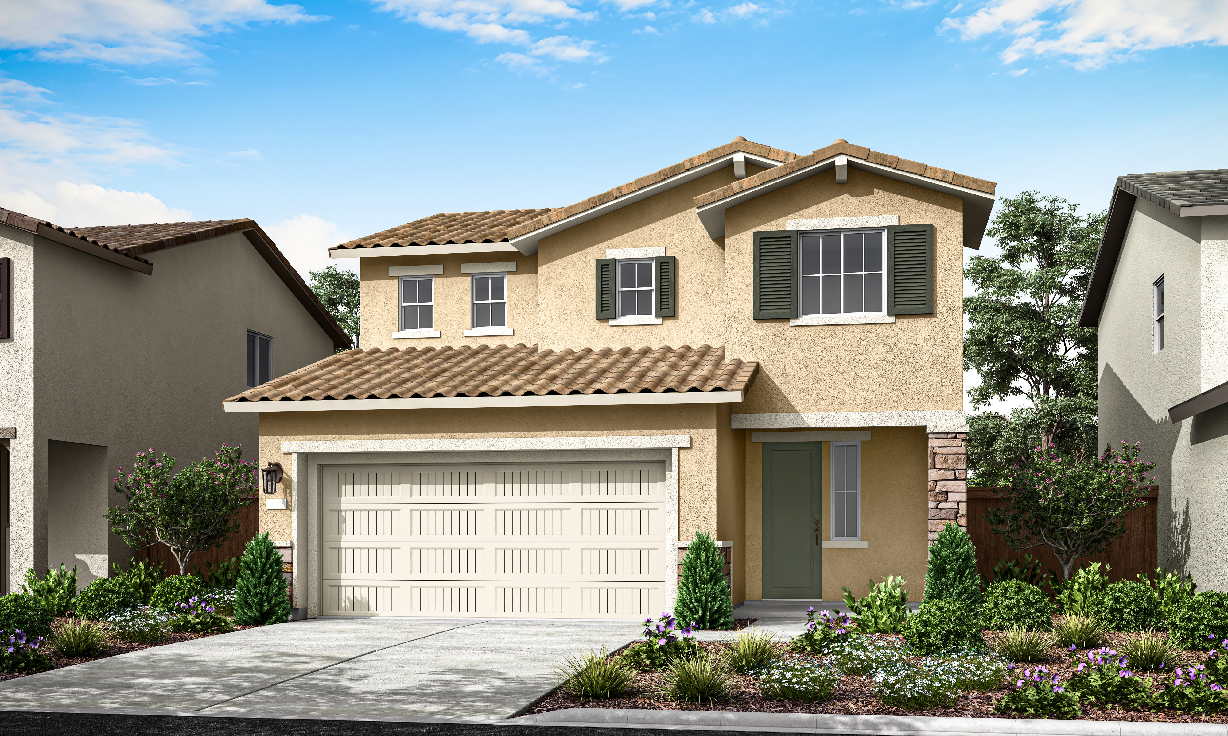 A two-story beige house with a tiled roof, a garage door, and a well-landscaped front yard with shrubs and flowers, set against a blue sky with scattered clouds.