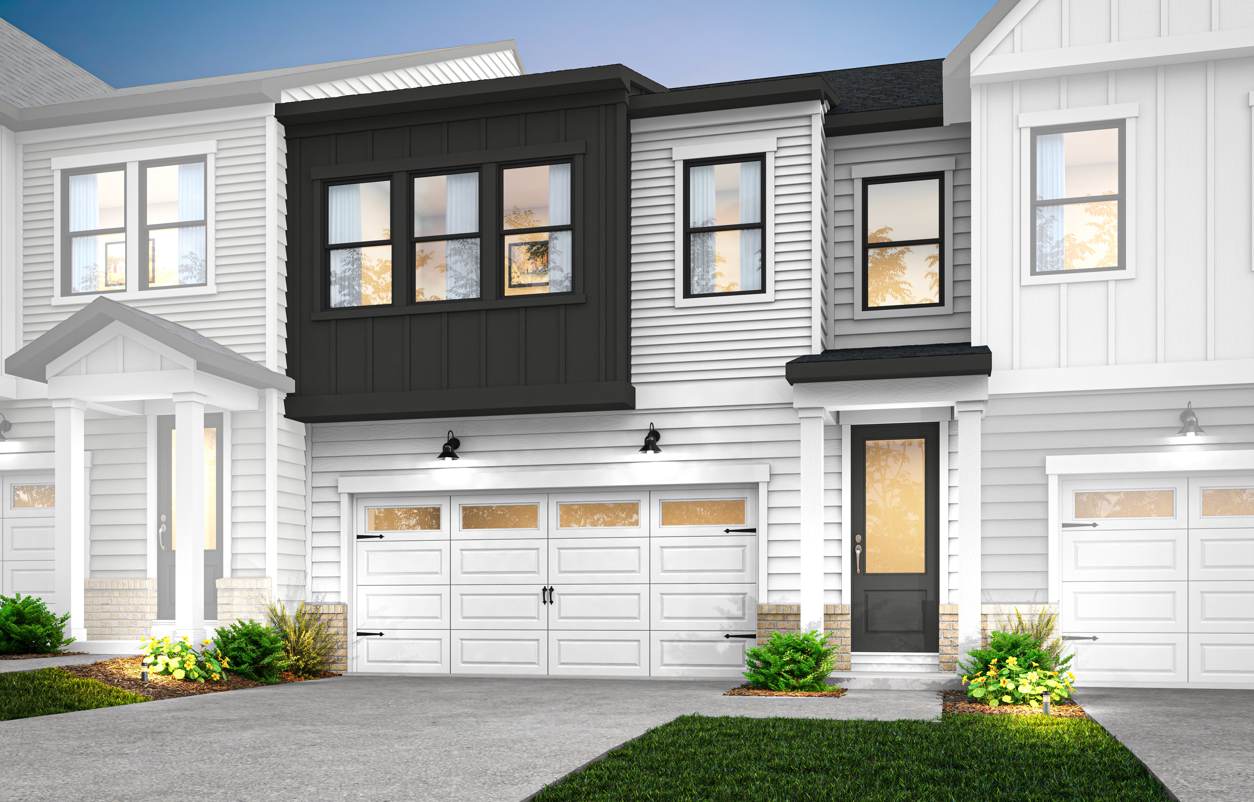 A modern townhouse with a white exterior, black accents, and a well-manicured lawn in the foreground.