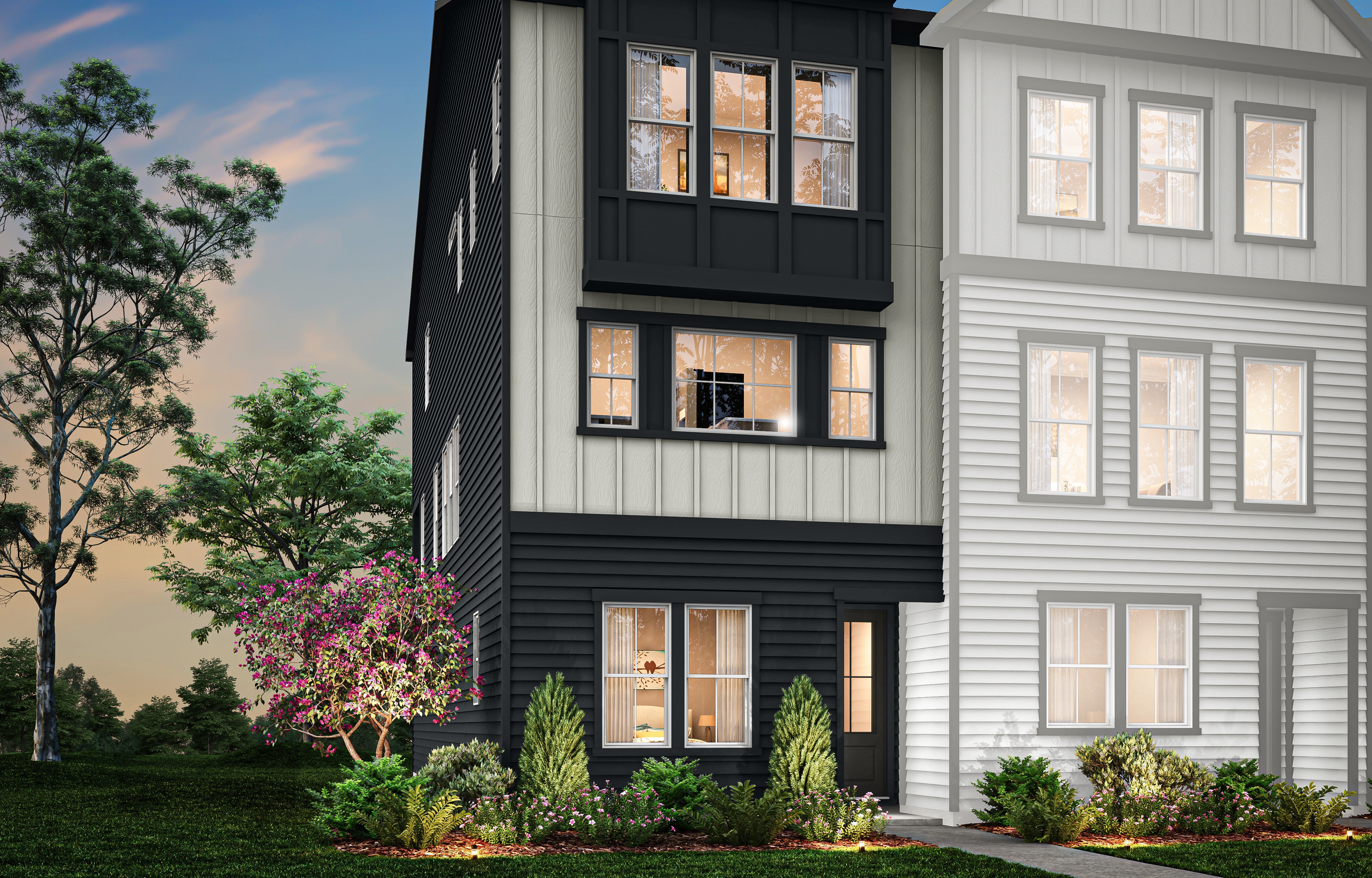 A multi-story residential building with a modern, black and white exterior design, surrounded by lush greenery and a vibrant sunset sky in the background.