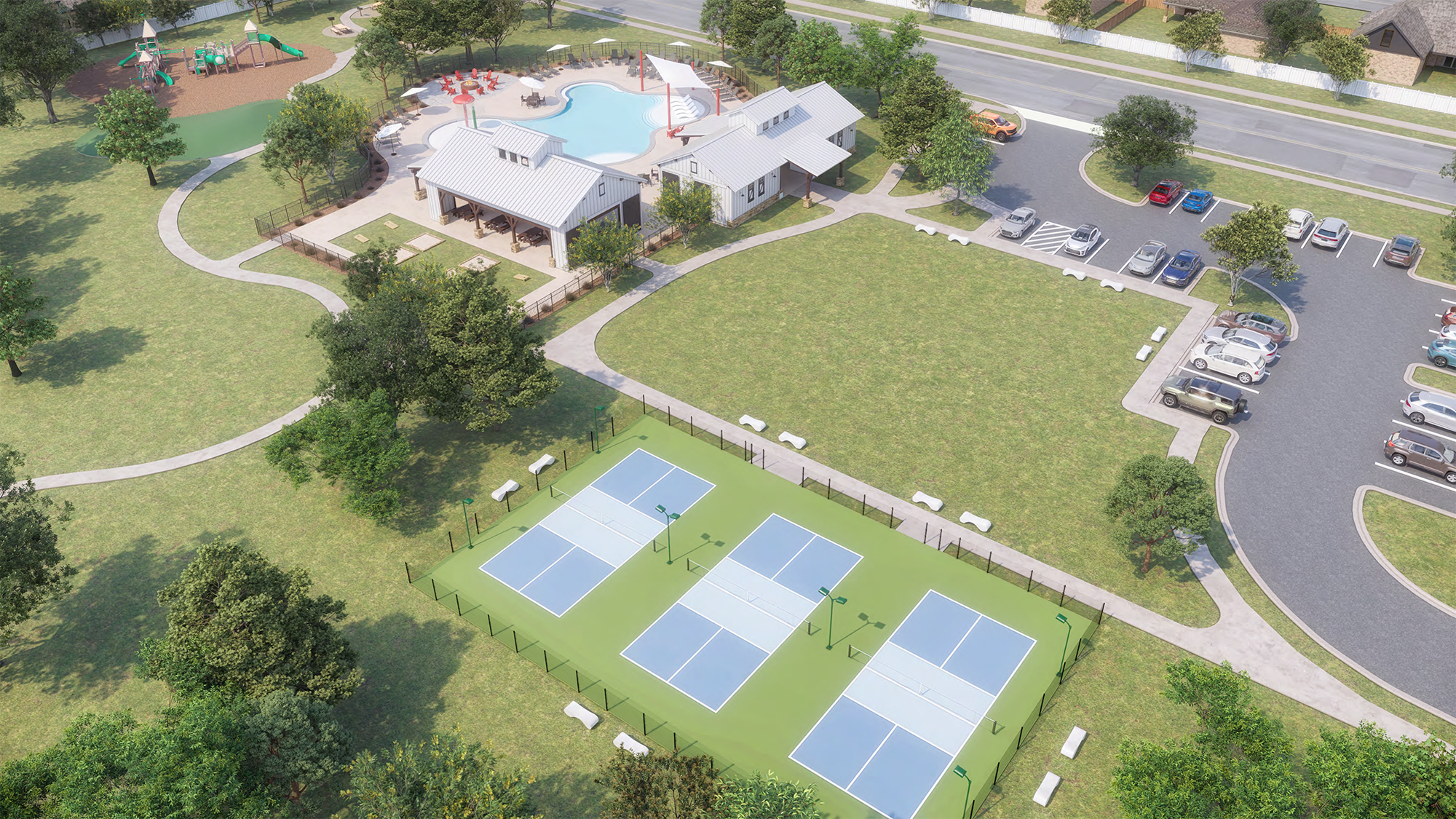 The image shows a large, multi-story building surrounded by a well-maintained lawn and landscaping, with several tennis courts visible in the foreground.