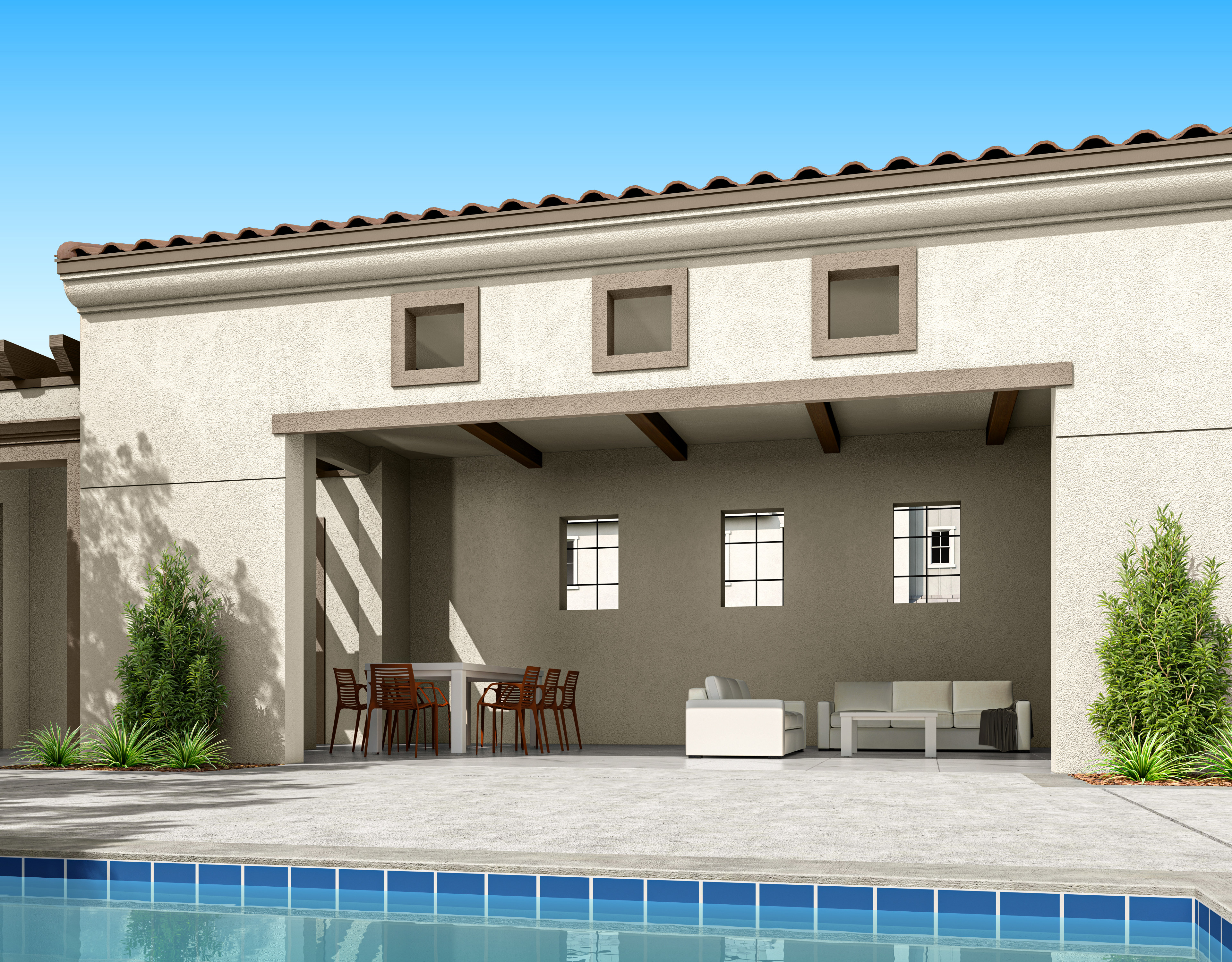 A modern, Mediterranean-style home with a covered patio, a swimming pool, and lush greenery in the foreground.