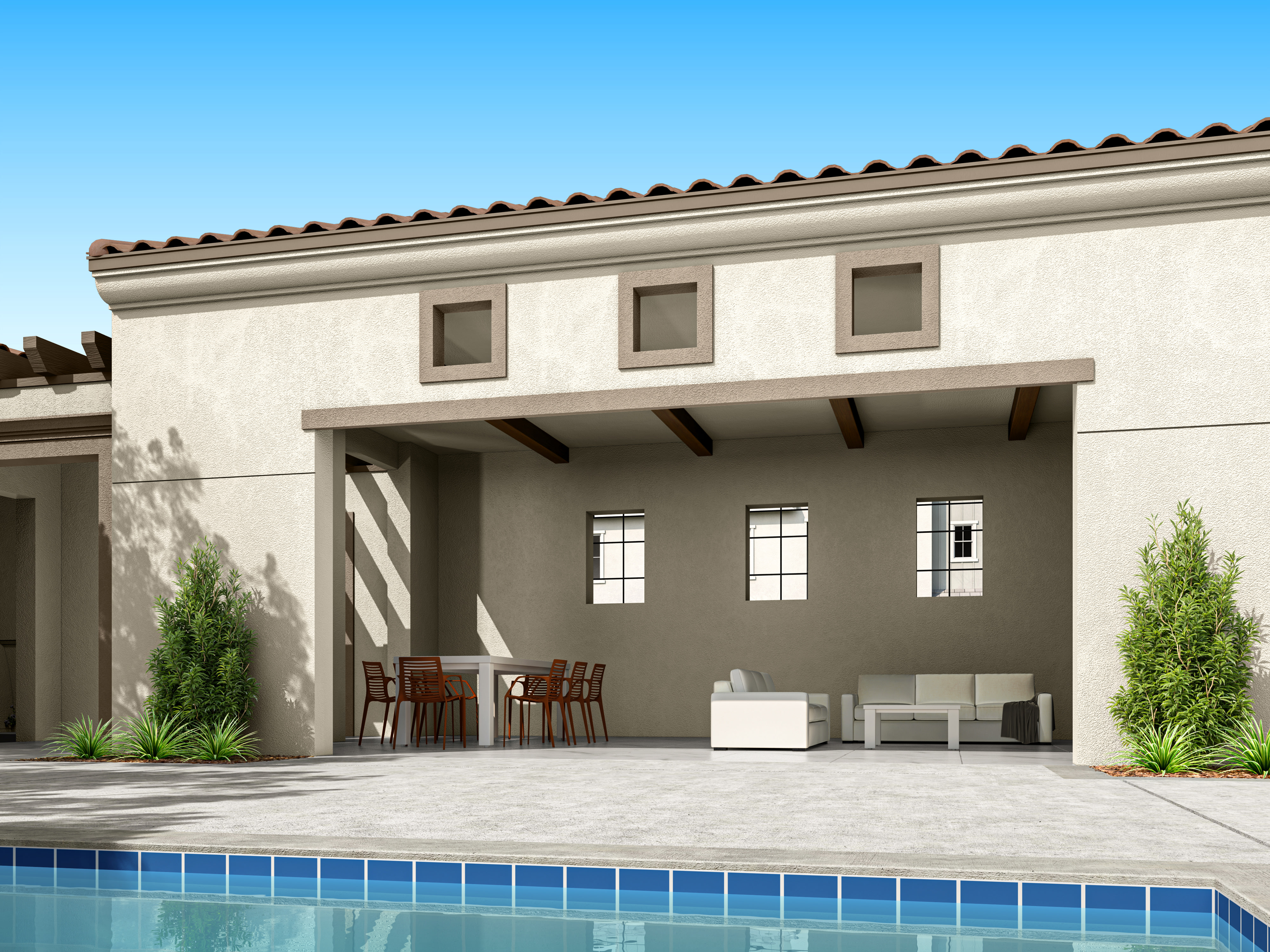 A modern, Mediterranean-style home with a covered patio, a swimming pool, and lush greenery in the foreground.