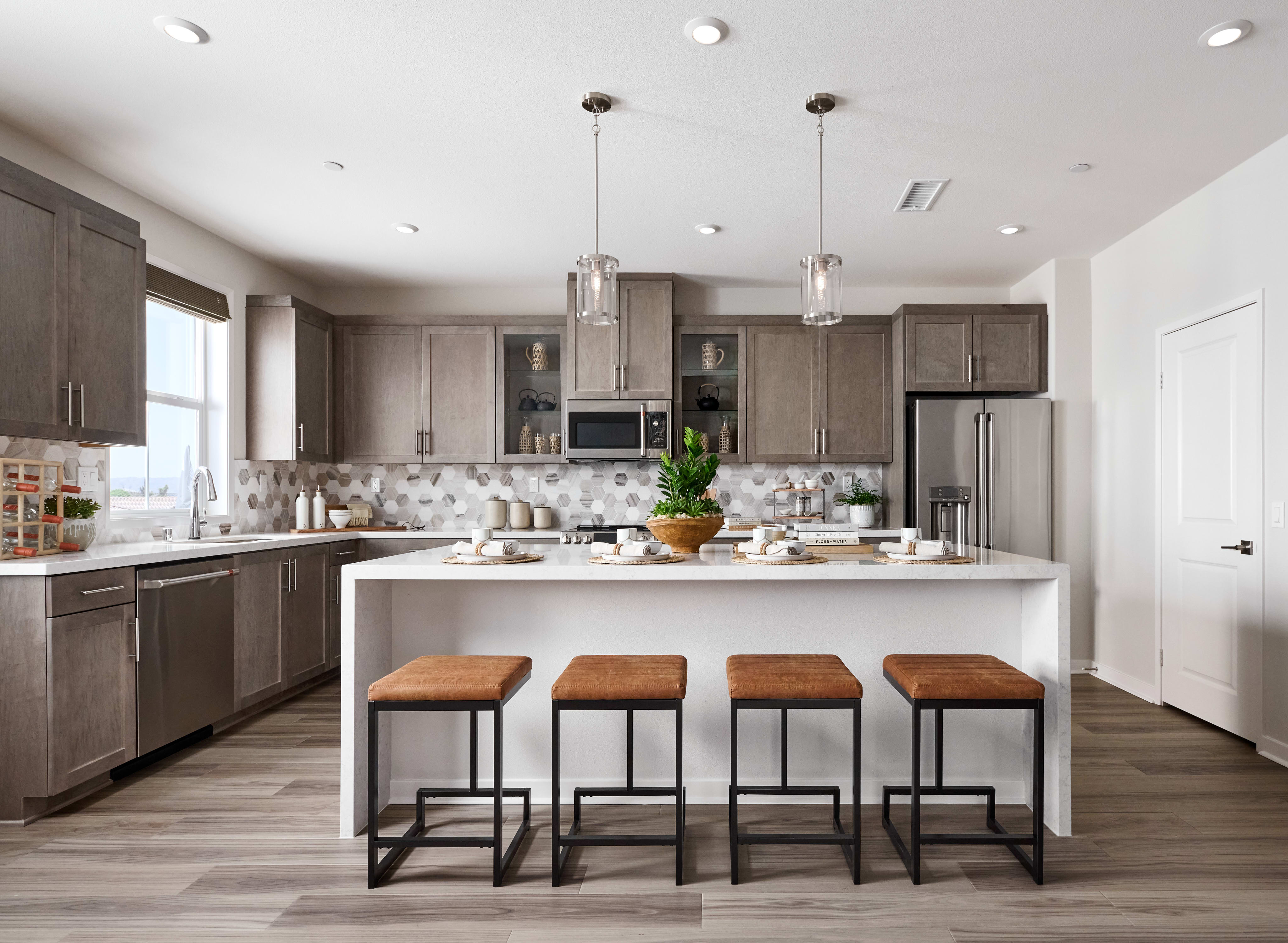 The multi-functional kitchen island expands counter space and is a natural hub for gathering. 