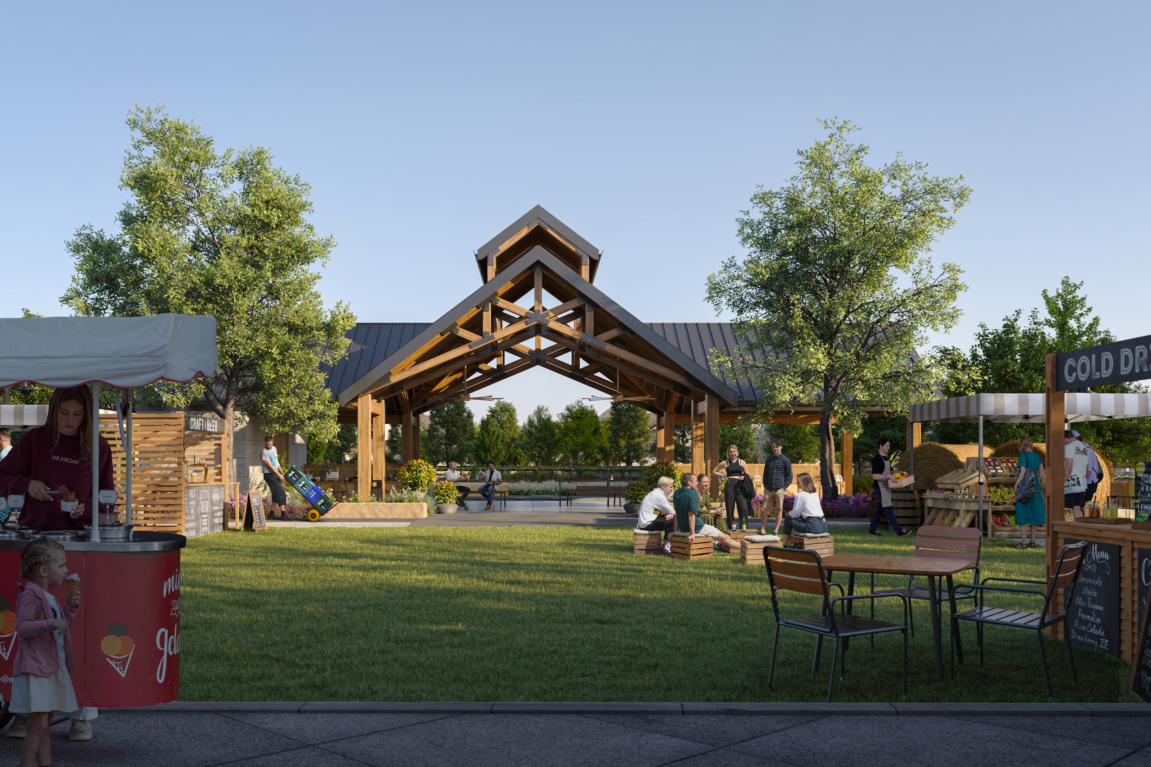 A grassy outdoor area with a wooden archway structure, surrounded by trees and people browsing various stalls or displays.