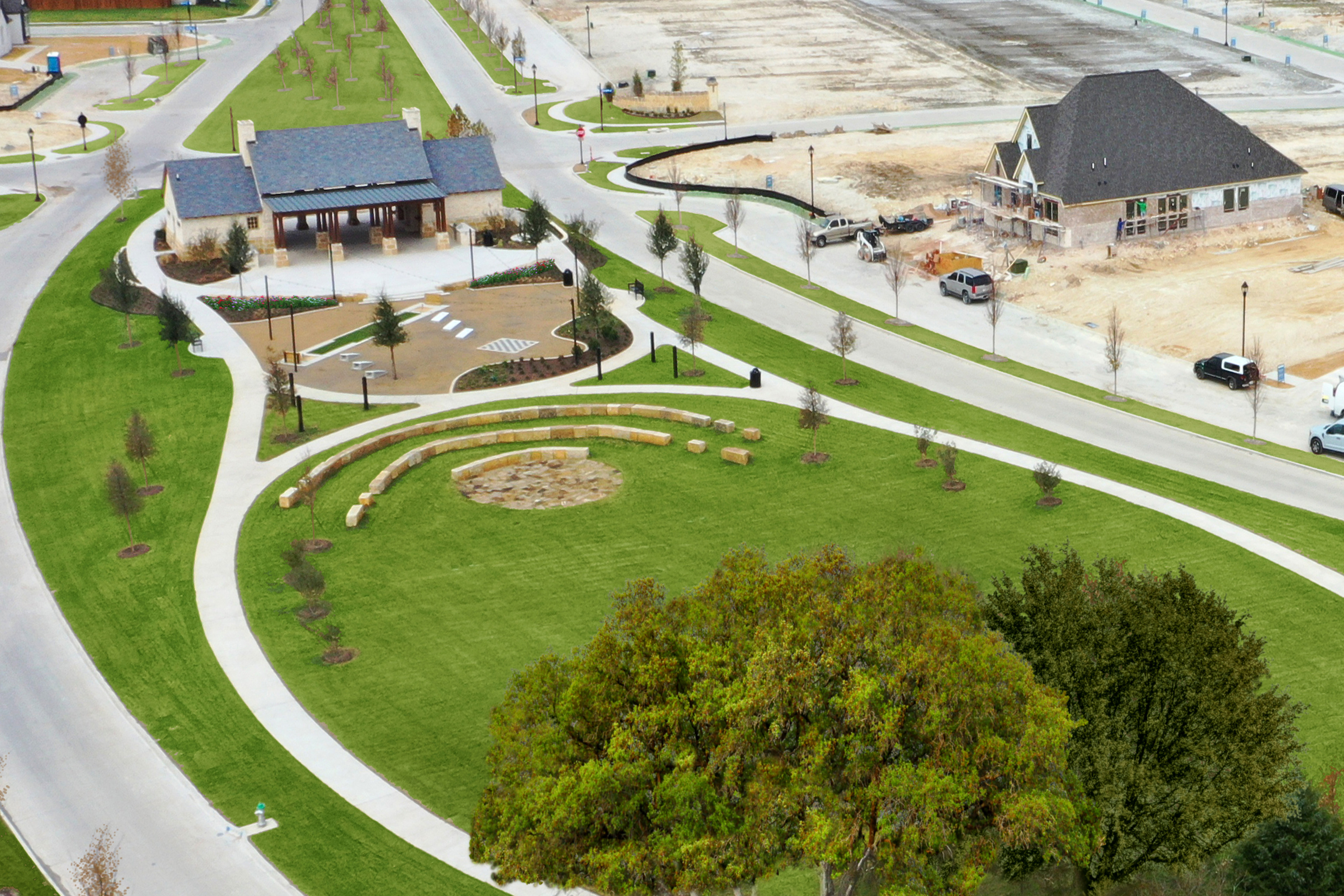 A well-designed residential community with neatly landscaped grounds, winding paths, and a mix of modern and traditional-style buildings nestled in a lush, green setting.