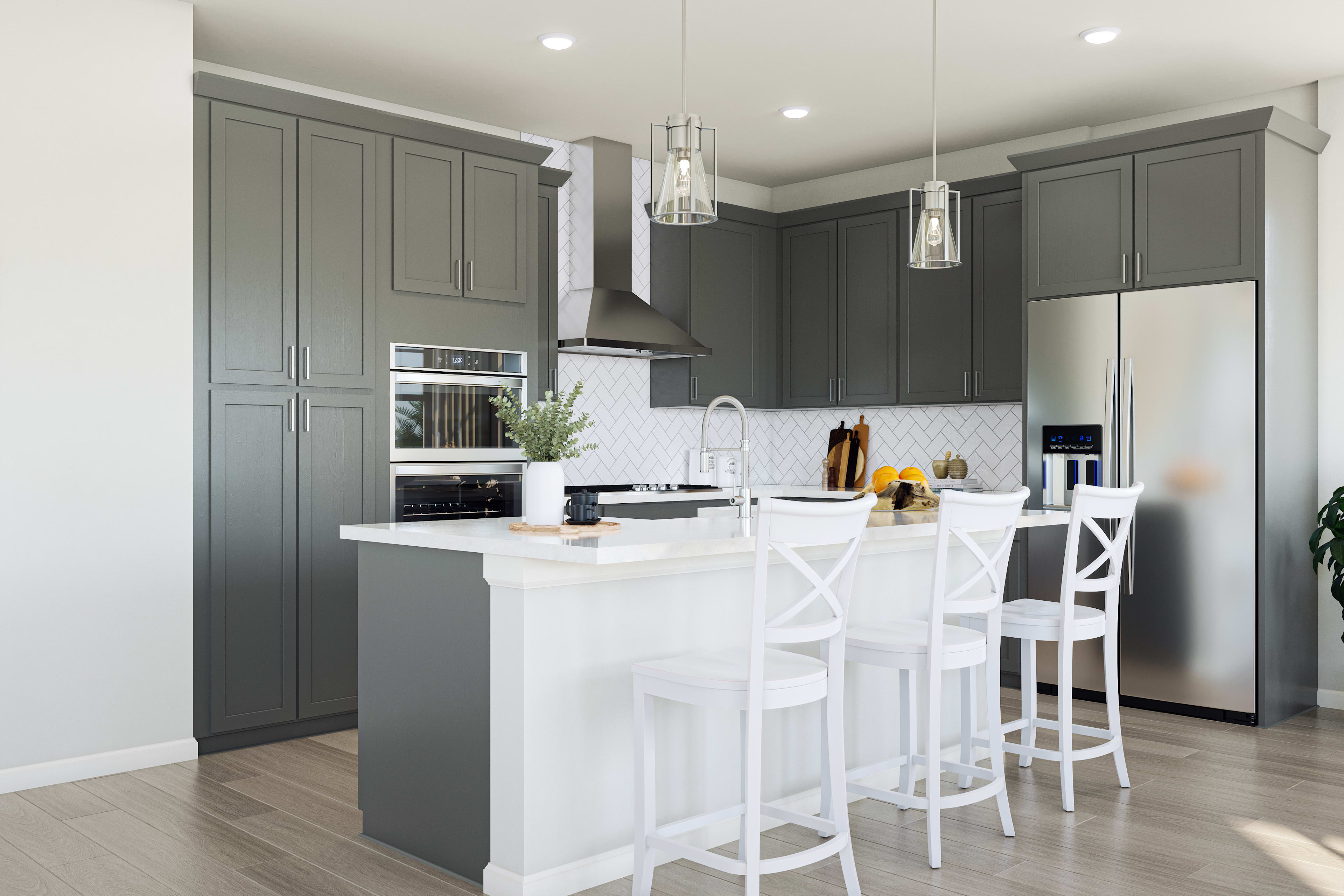 A modern, well-designed kitchen with gray cabinets, white countertops, and a central island with bar stools, complemented by pendant lighting and a sleek, minimalist aesthetic.