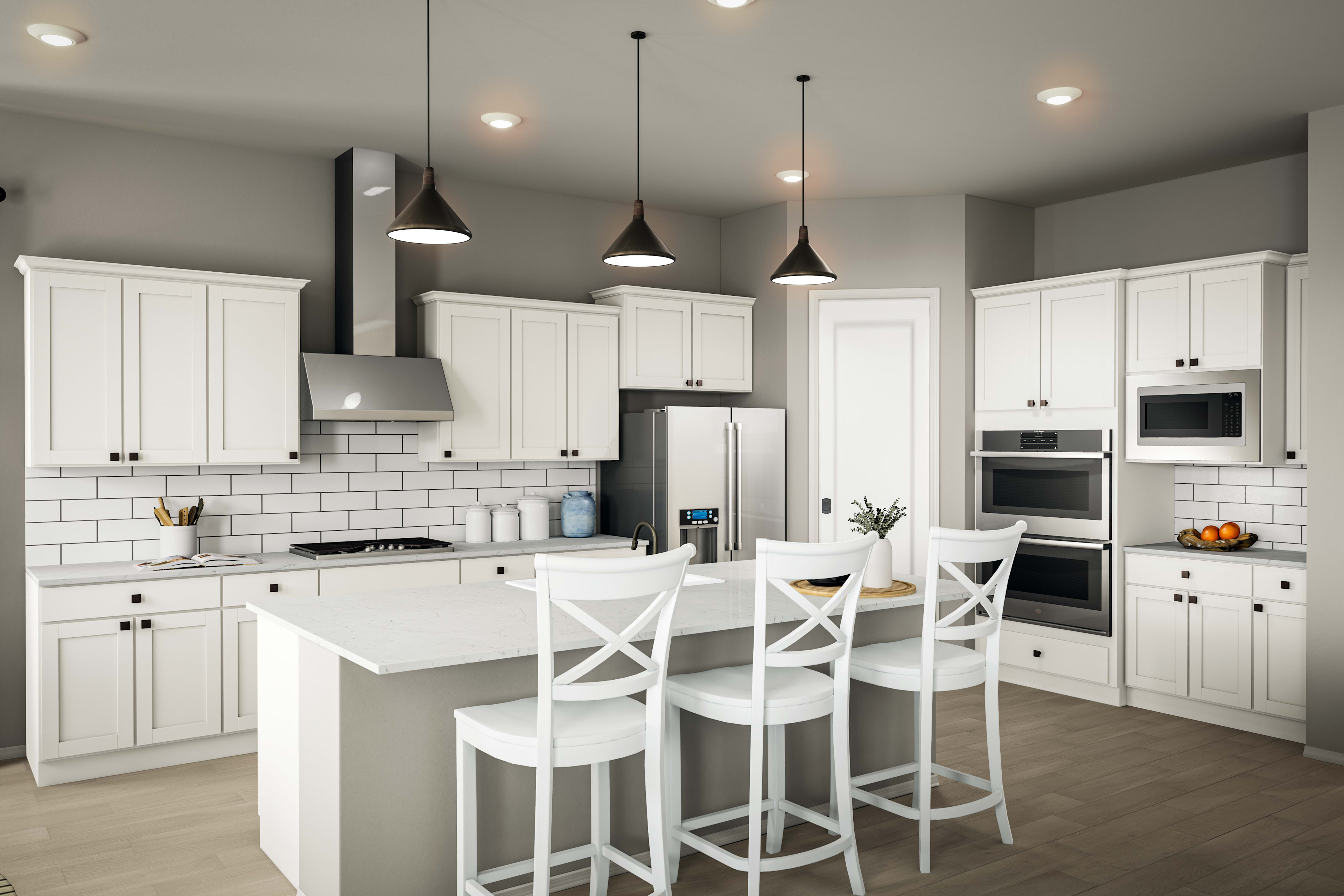 A modern, well-lit kitchen with white cabinets, a white countertop, and pendant lights hanging above a central island with bar stools.