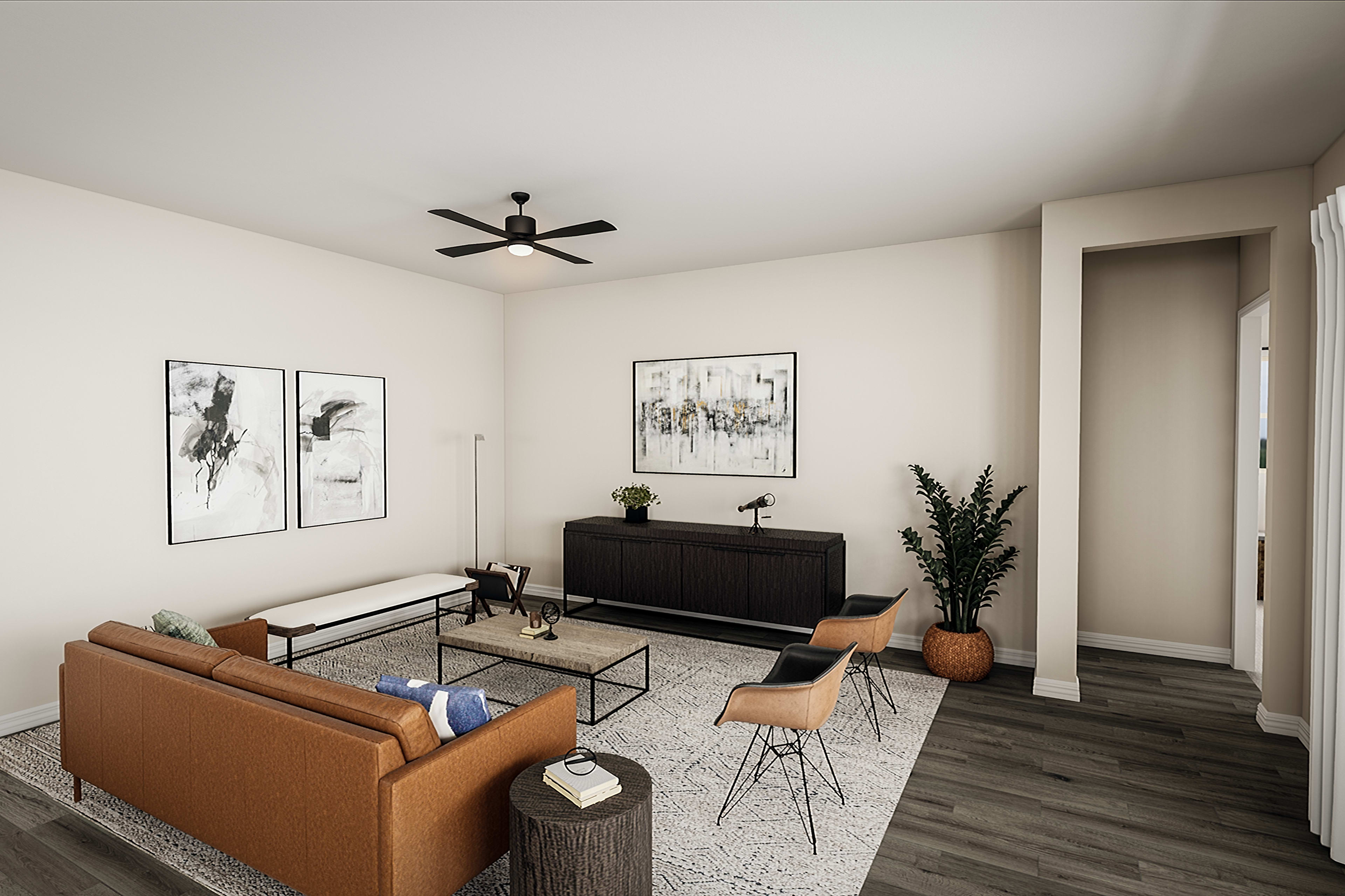 A modern and minimalist living room with a black ceiling fan, framed artwork on the walls, and a wooden entertainment unit with various decorative elements.