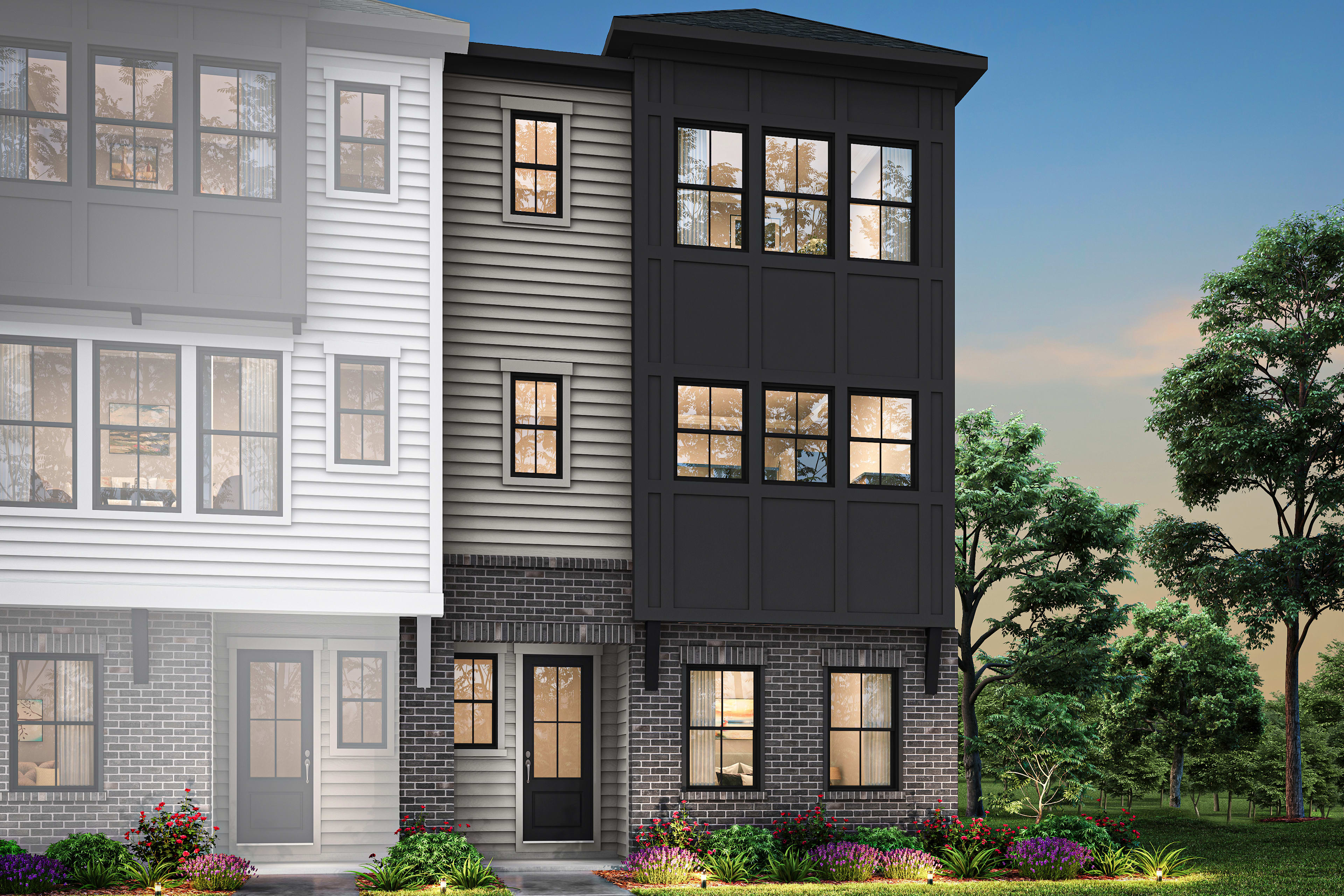 A modern, multi-story townhouse with a mix of white siding and black accents, surrounded by lush greenery and landscaping in the foreground.