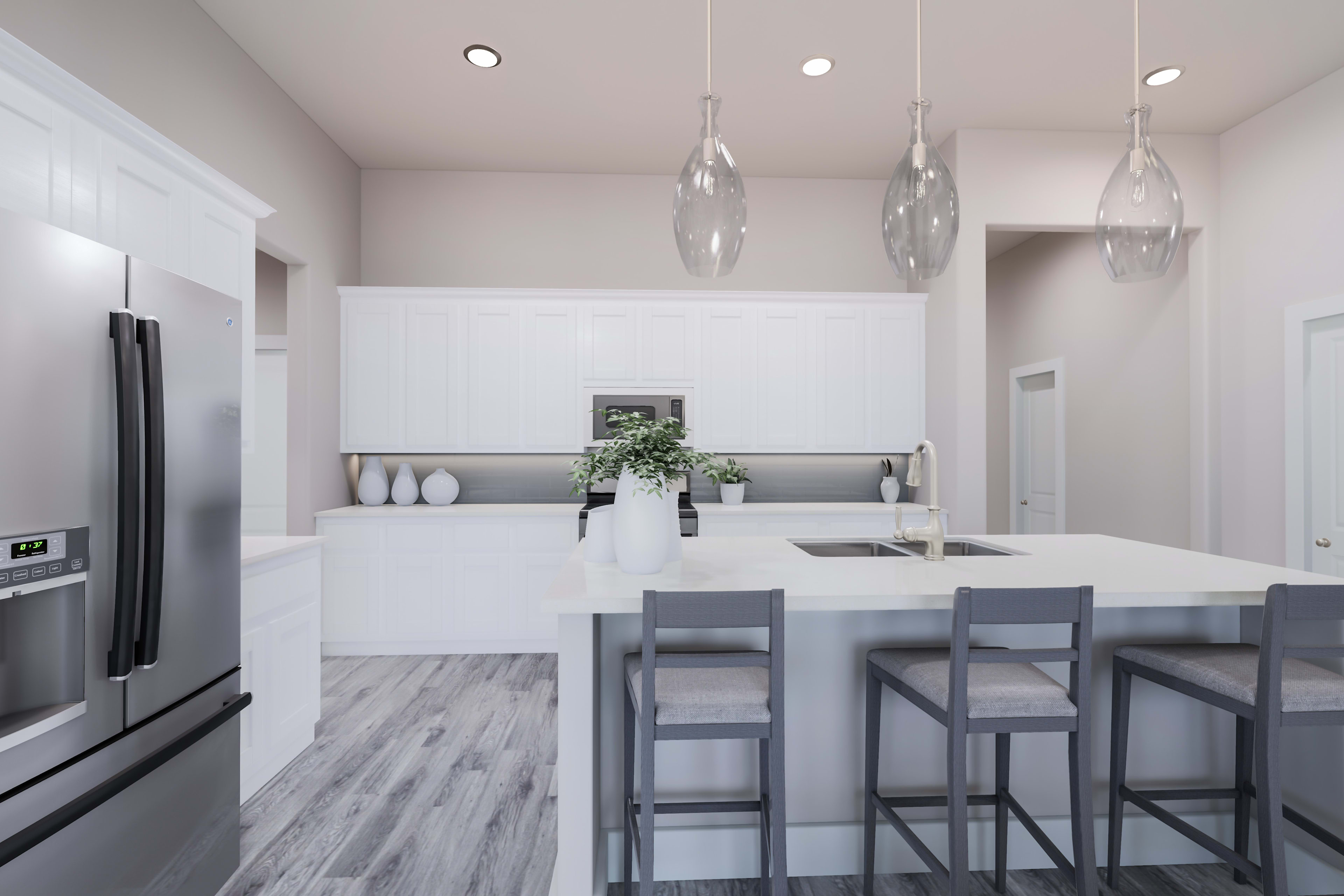 A modern, minimalist kitchen with white cabinets, gray bar stools, and pendant lights hanging above the kitchen island.