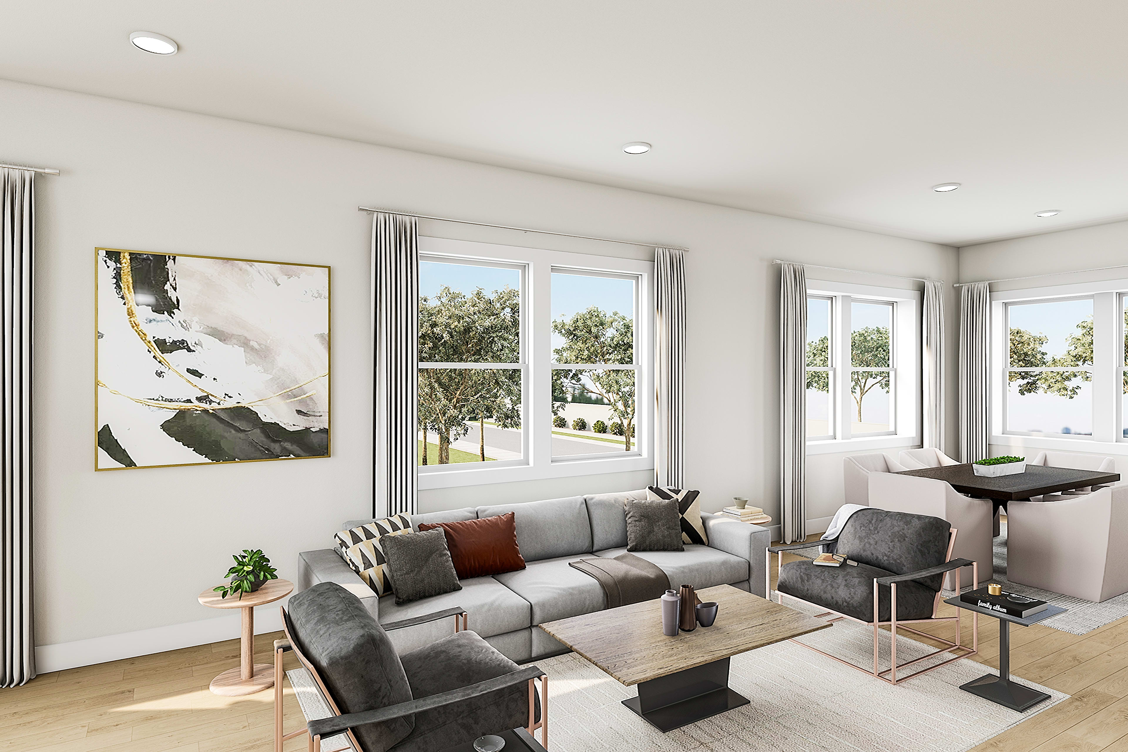 A modern and minimalist living room with large windows overlooking a scenic outdoor landscape, featuring a gray sectional sofa, a wooden coffee table, and a large abstract artwork on the wall.