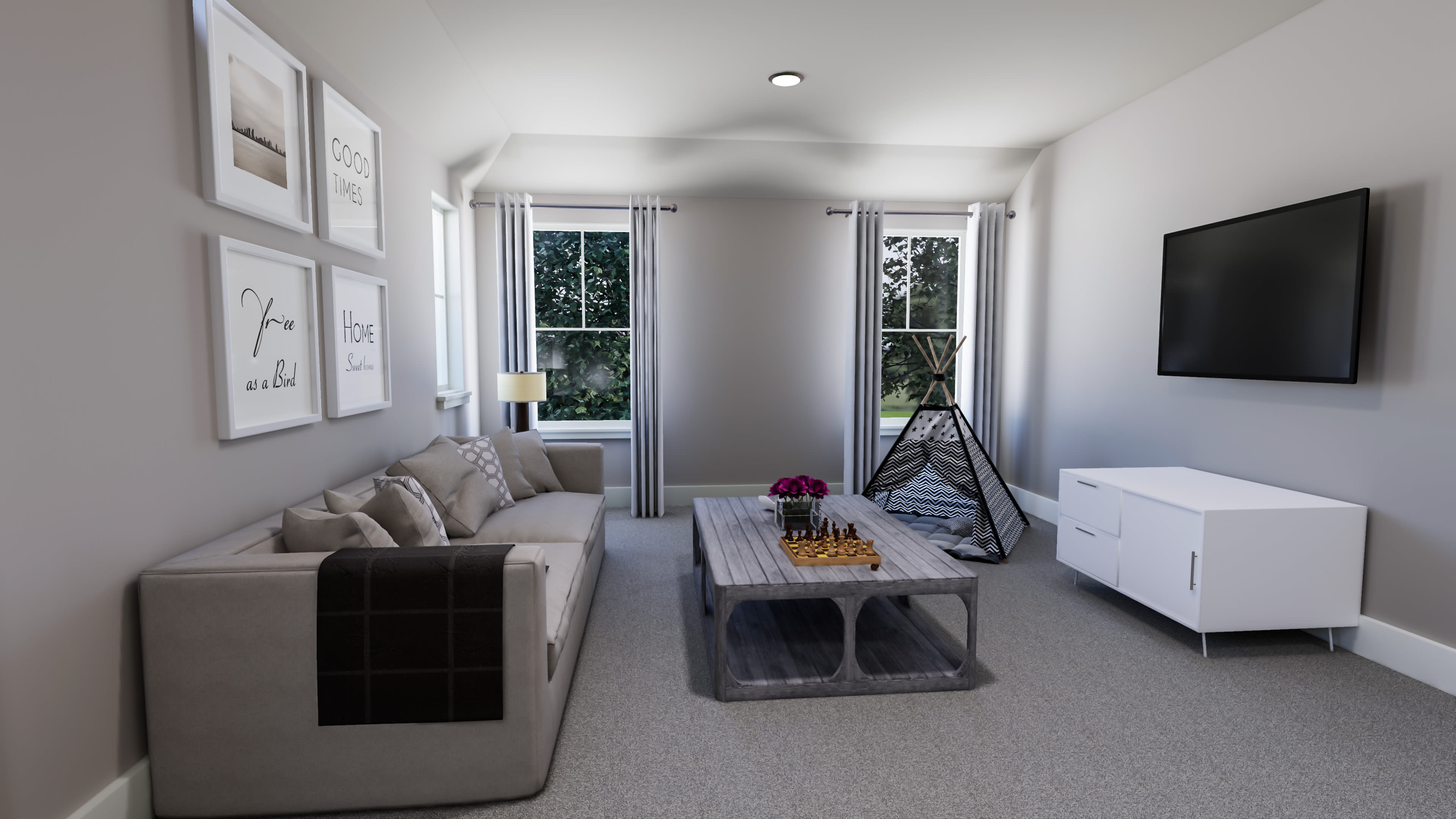 A cozy and minimalist living room with a gray sofa, a wooden coffee table, and a large TV mounted on the wall, surrounded by framed artwork and a window overlooking the outdoors.