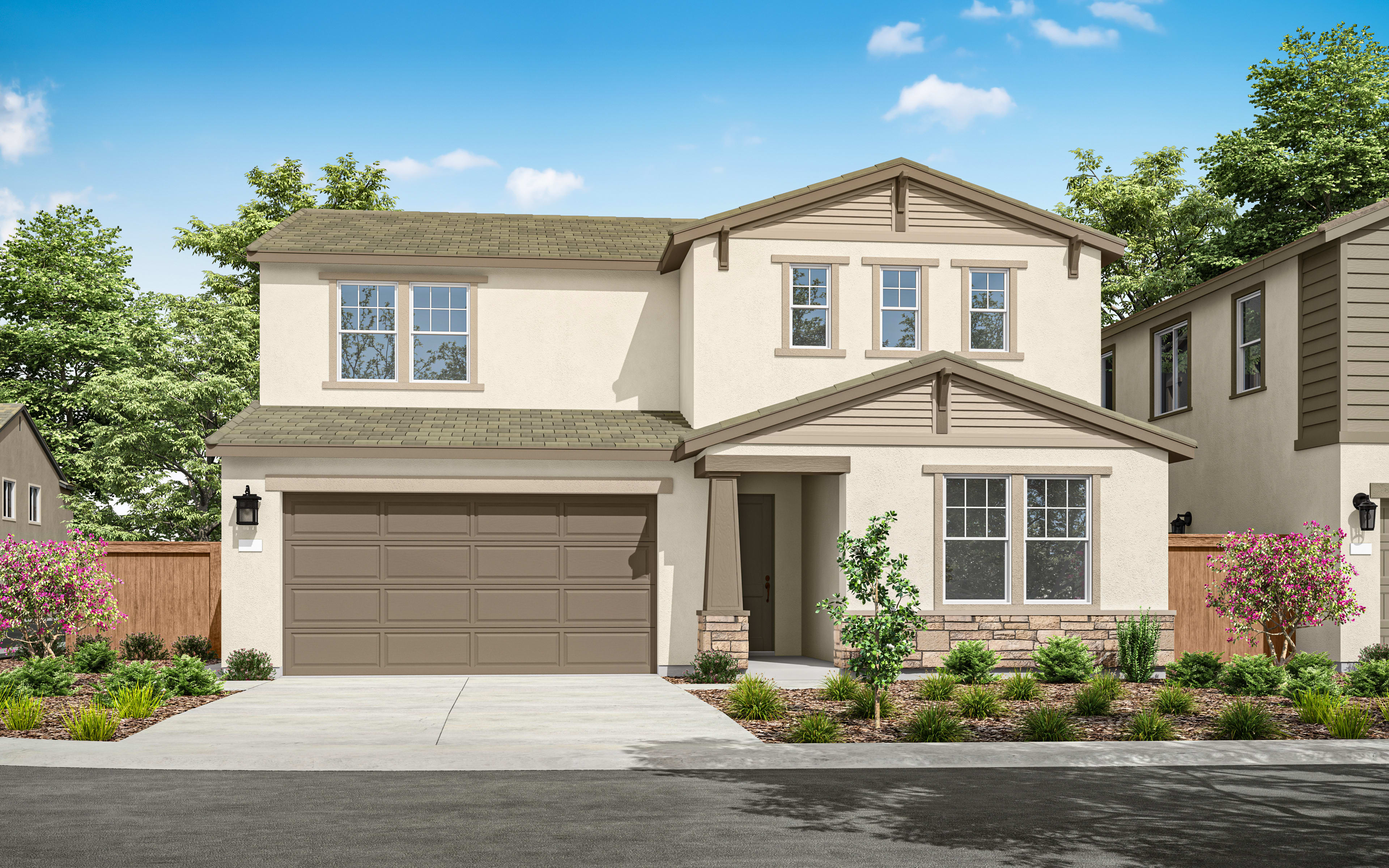 A two-story residential house with a garage, surrounded by lush greenery and a paved driveway in the foreground.