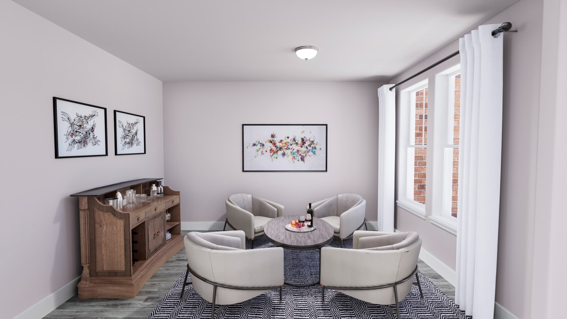 A cozy and modern dining area with a wooden sideboard, framed artwork, and a round table surrounded by plush, upholstered chairs.