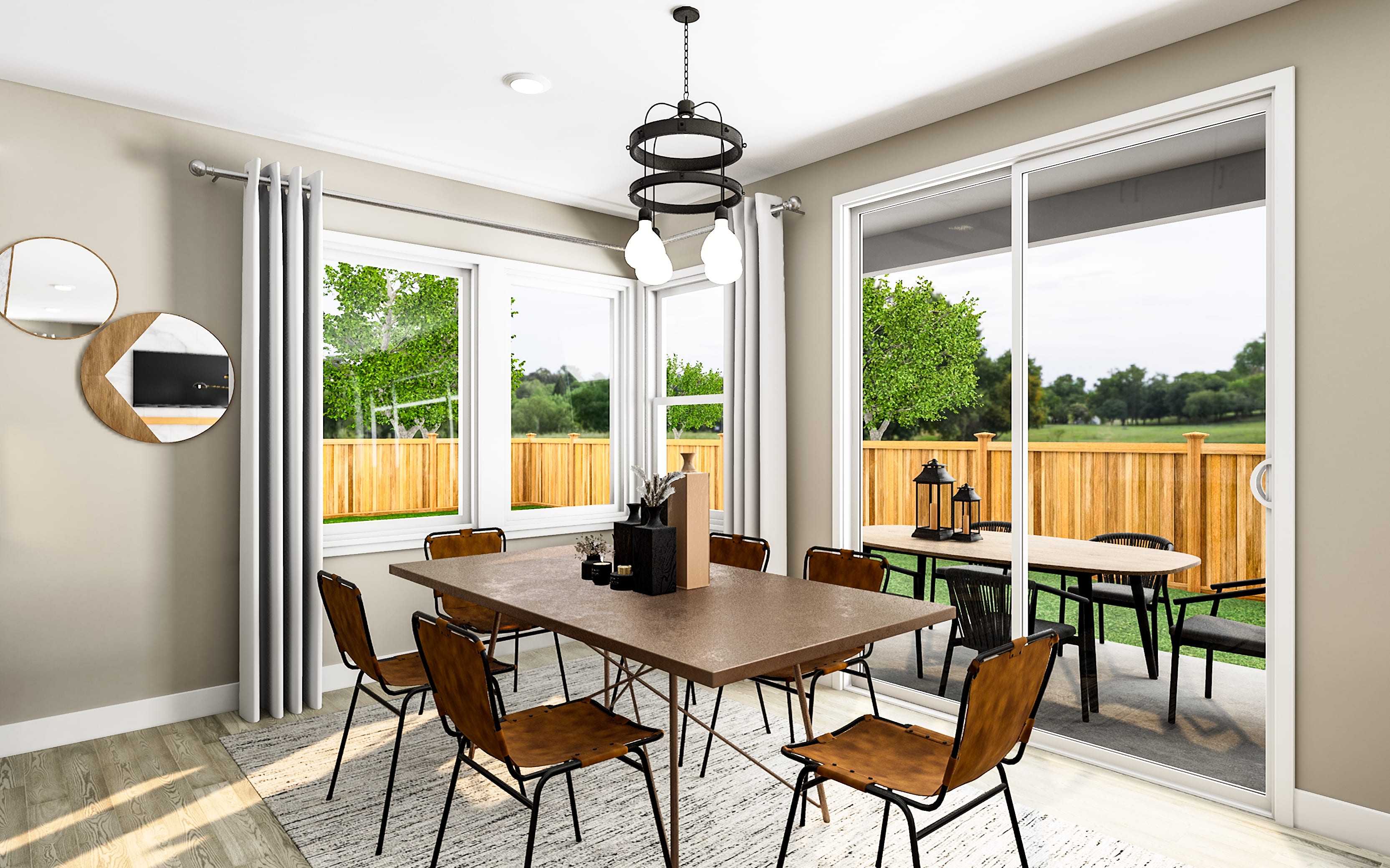 A modern dining room with a wooden table and chairs in the foreground opens to a backyard patio with an outdoor dining set visible through sliding glass doors in the background.
