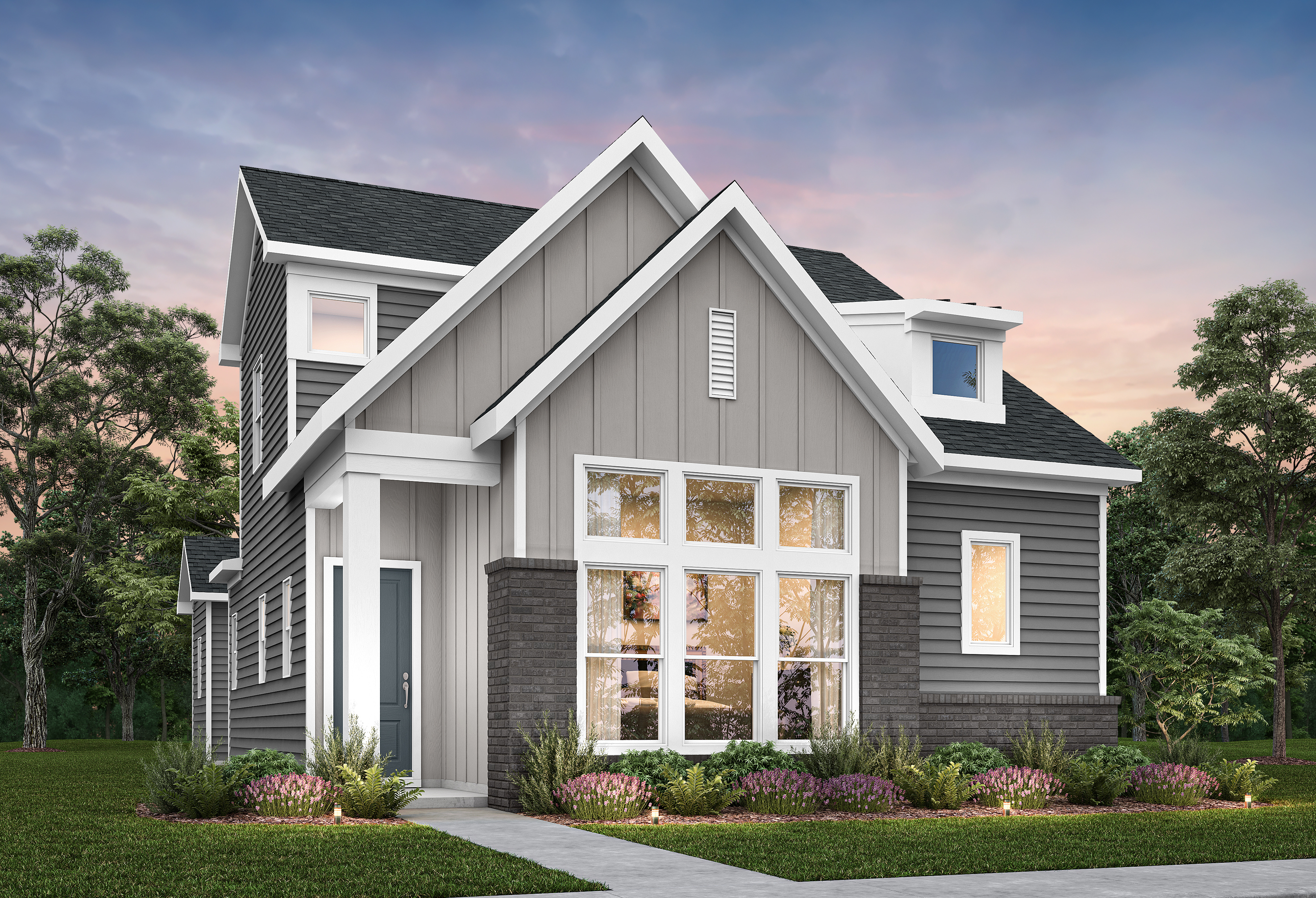 A modern gray house with a large front window and manicured landscaping sits under a twilight sky.