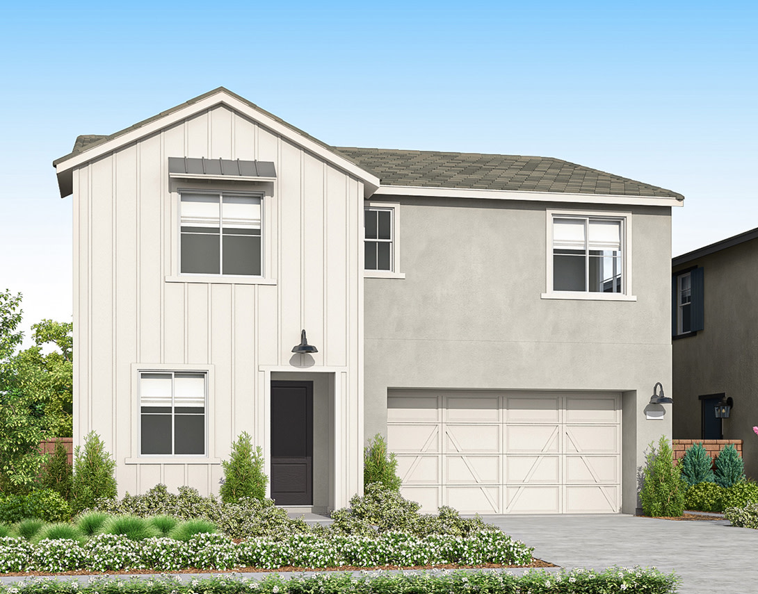 A modern two-story house with a white vertical siding front and a stucco side stands behind a lush green lawn and landscaping, under a clear blue sky.