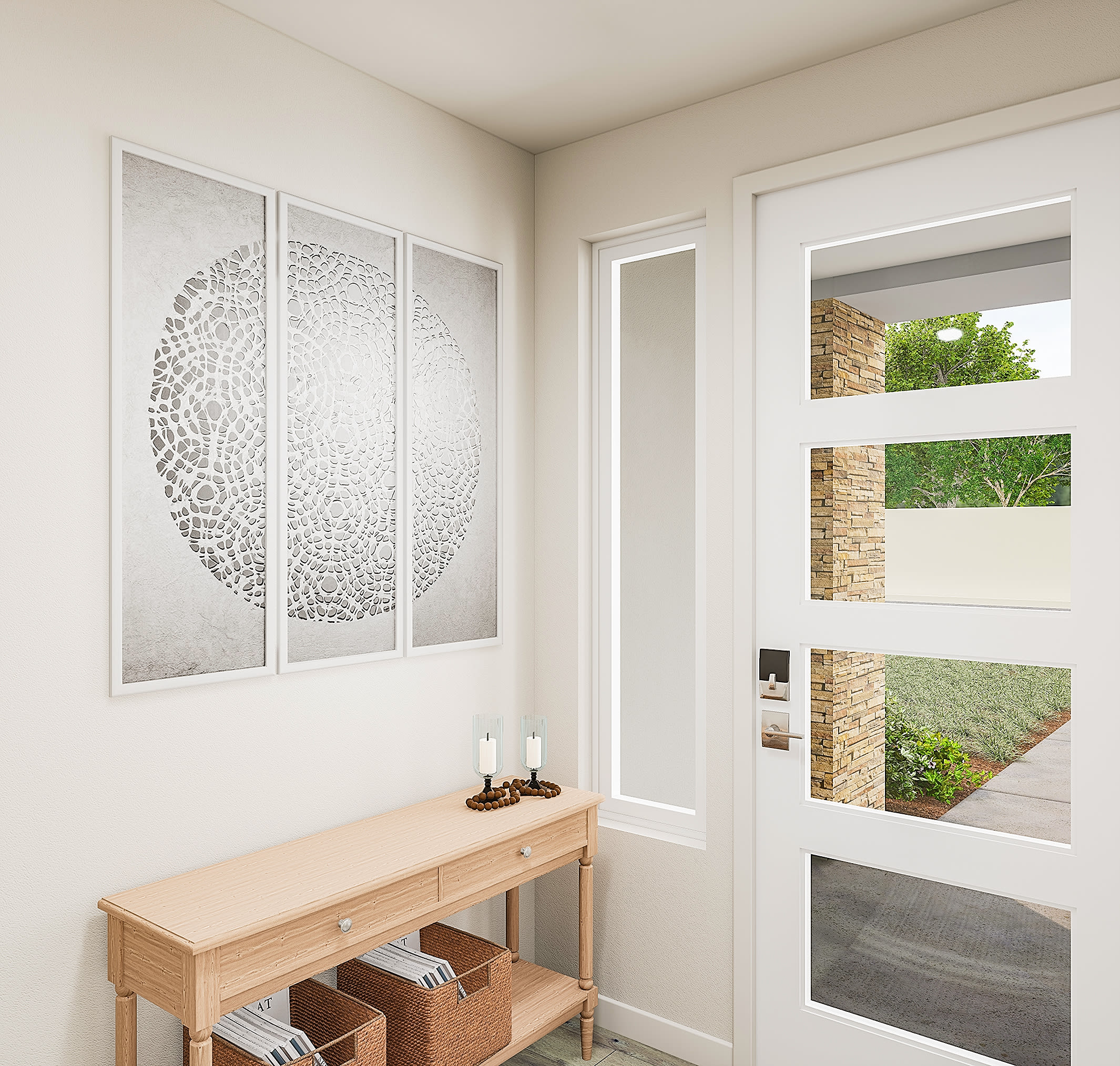 A light wood console table with woven baskets sits in the foreground beneath a triptych of circular art, while a modern glass-paneled door reveals a sunlit exterior with stone accents and greenery in the background.