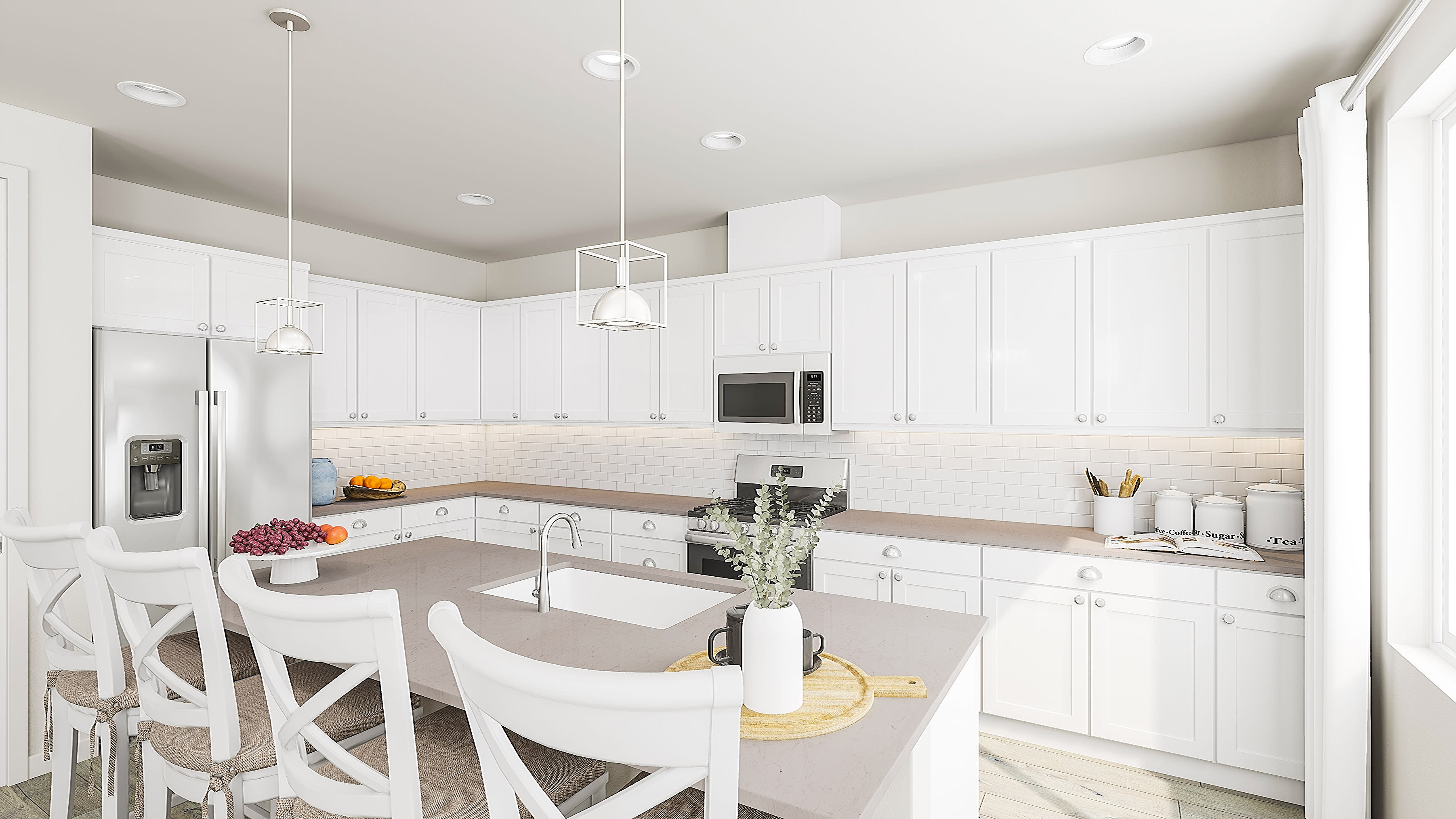 A modern white kitchen with a large island in the foreground and white cabinets and appliances filling the background.