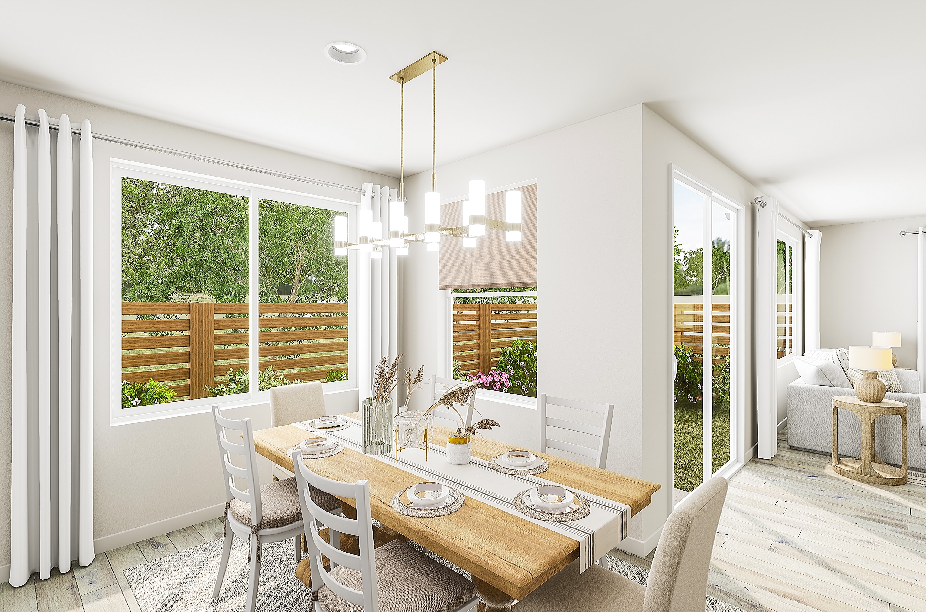 A bright dining room with a wooden table set for a meal in the foreground, and a sunny backyard visible through large windows in the background.