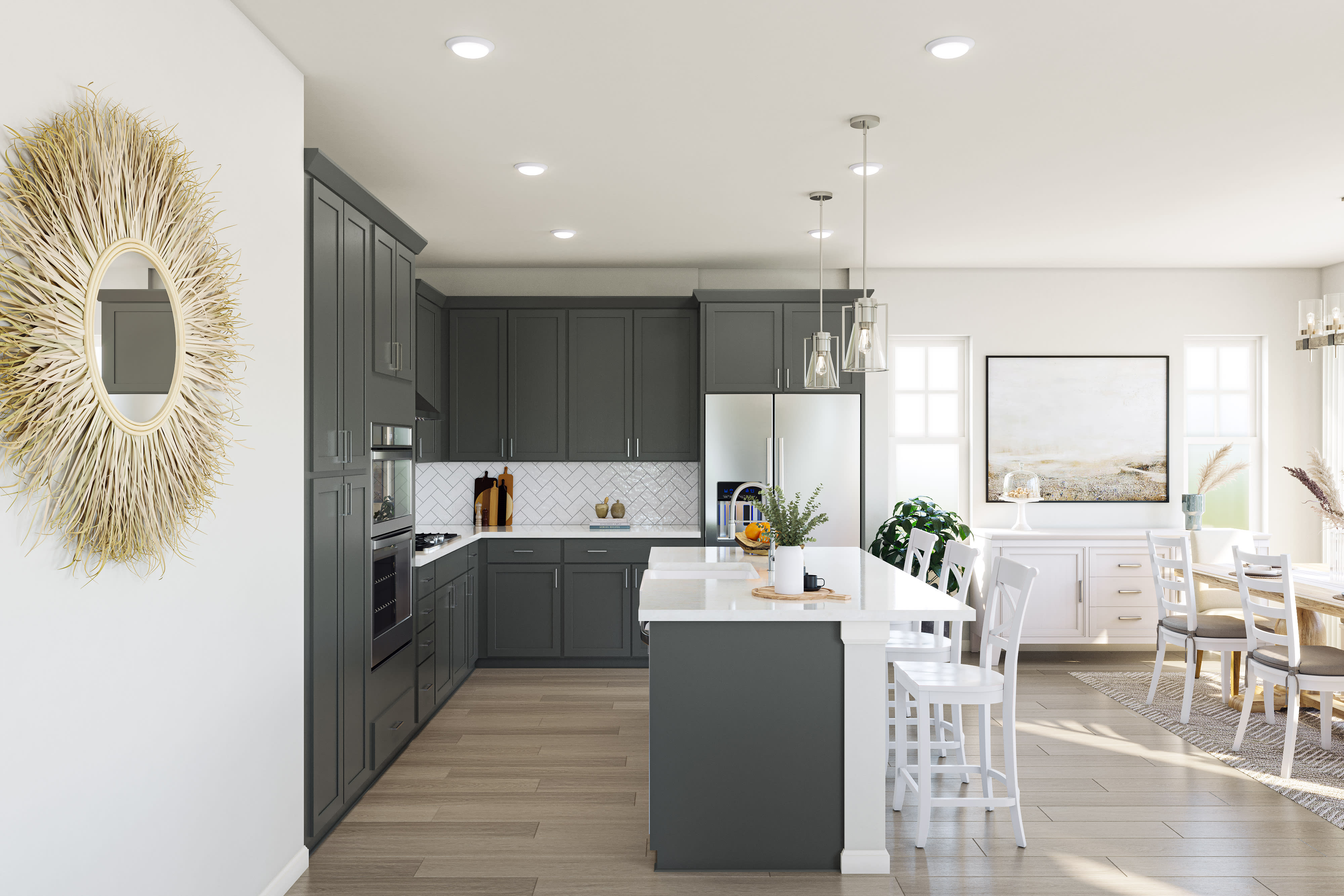 A modern, open-concept kitchen with dark gray cabinets, a white island, and pendant lighting, set against a bright and airy living space with hardwood floors.
