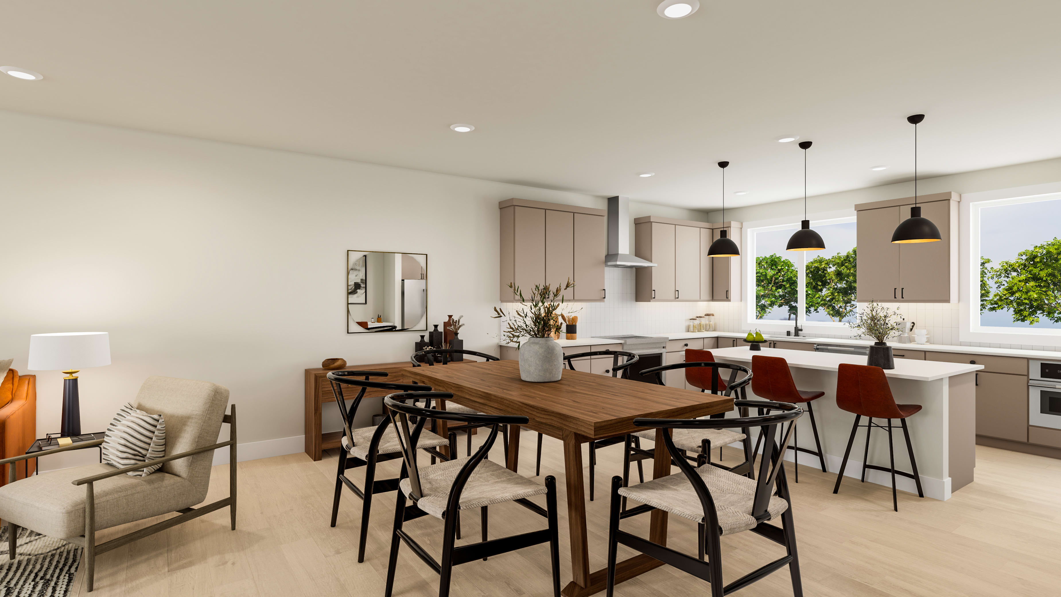 A modern and stylish kitchen and dining area with a wooden table, black chairs, and pendant lights, set against a bright and airy backdrop with large windows overlooking the outdoors.