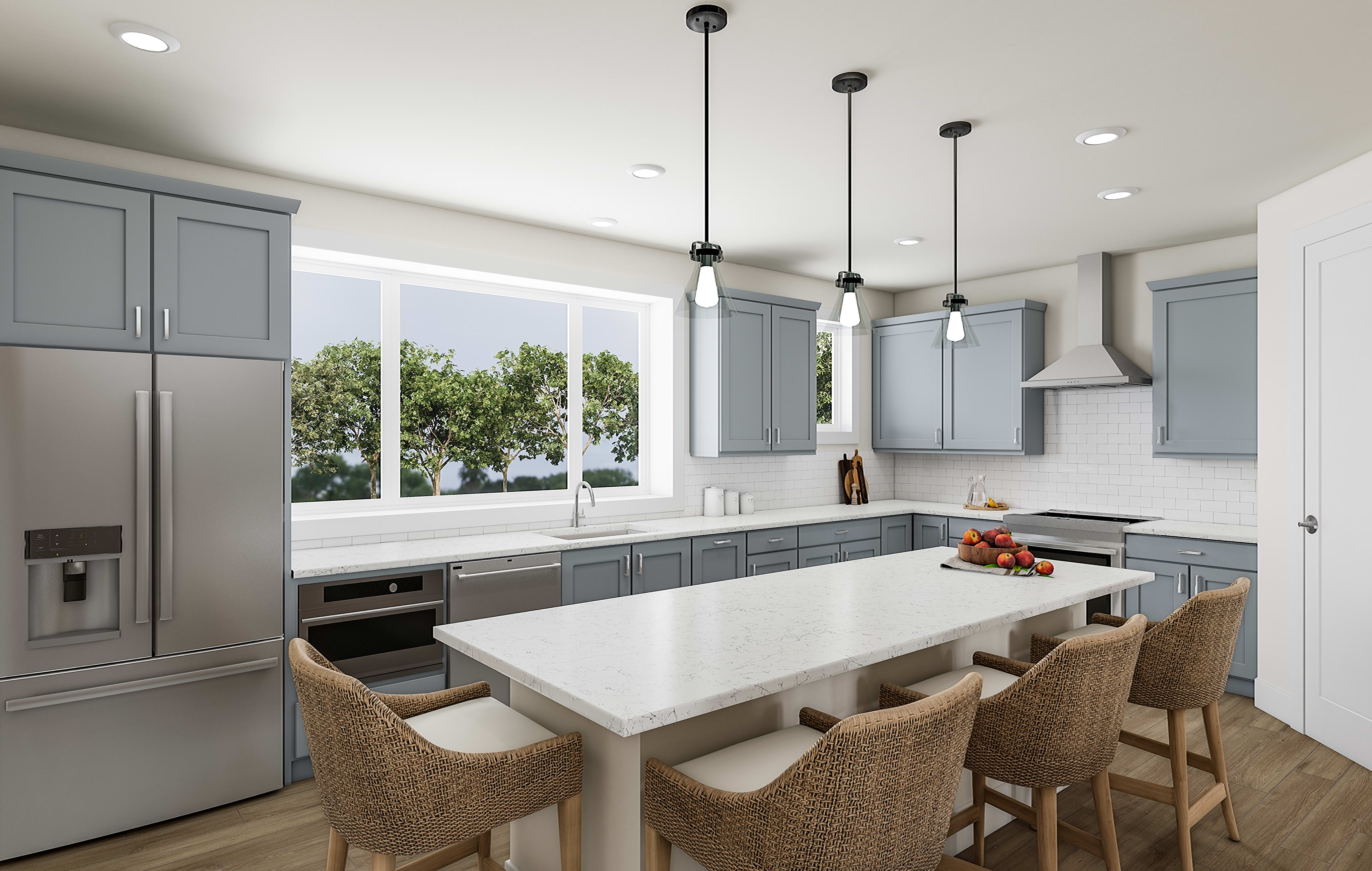 A modern, open-concept kitchen with gray cabinets, white countertops, and pendant lighting over a wooden dining table with wicker chairs.