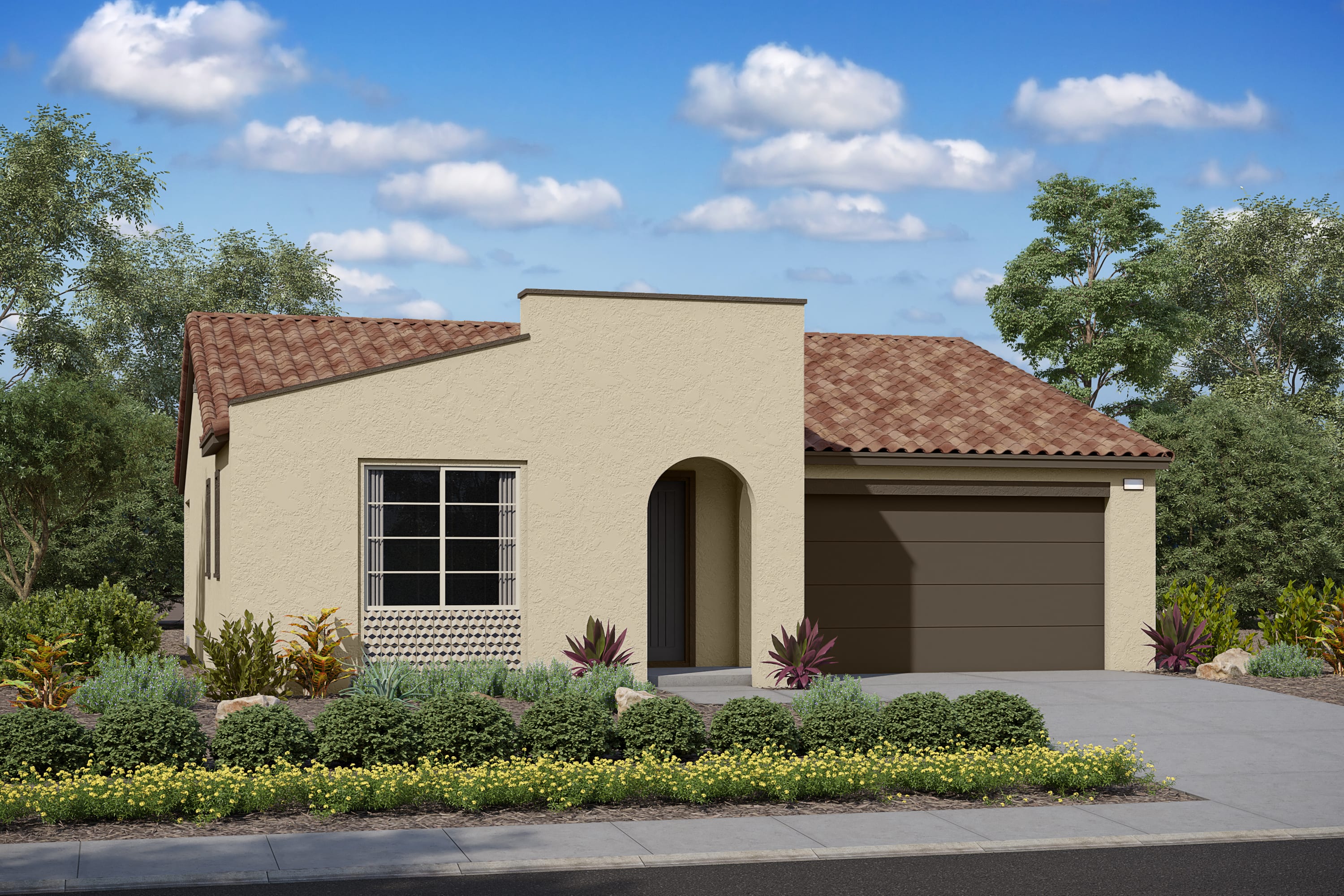 A single-story, beige-colored house with a tiled roof sits in a well-landscaped yard, surrounded by lush greenery and a clear blue sky with fluffy white clouds.