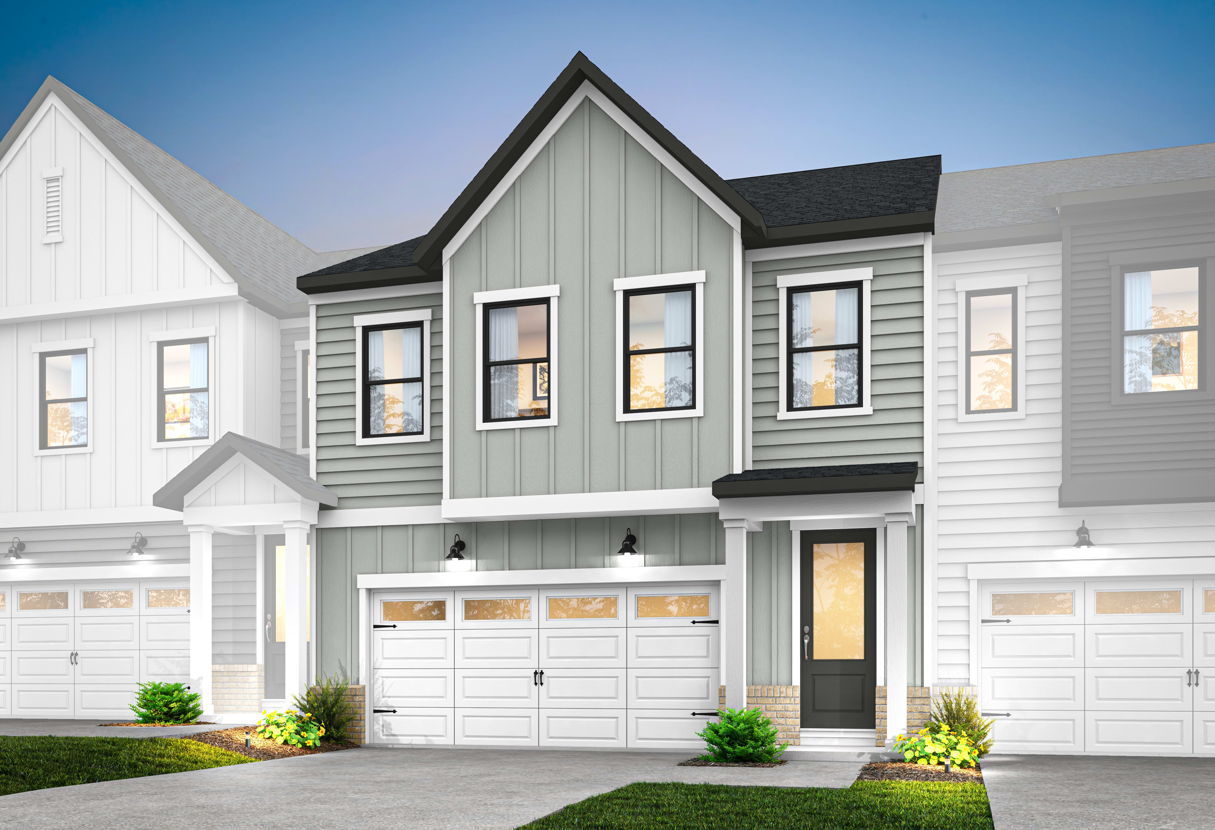 A modern, two-story townhouse with a gray exterior, white trim, and a prominent gable roof stands in the foreground, surrounded by a well-manicured lawn and landscaping.