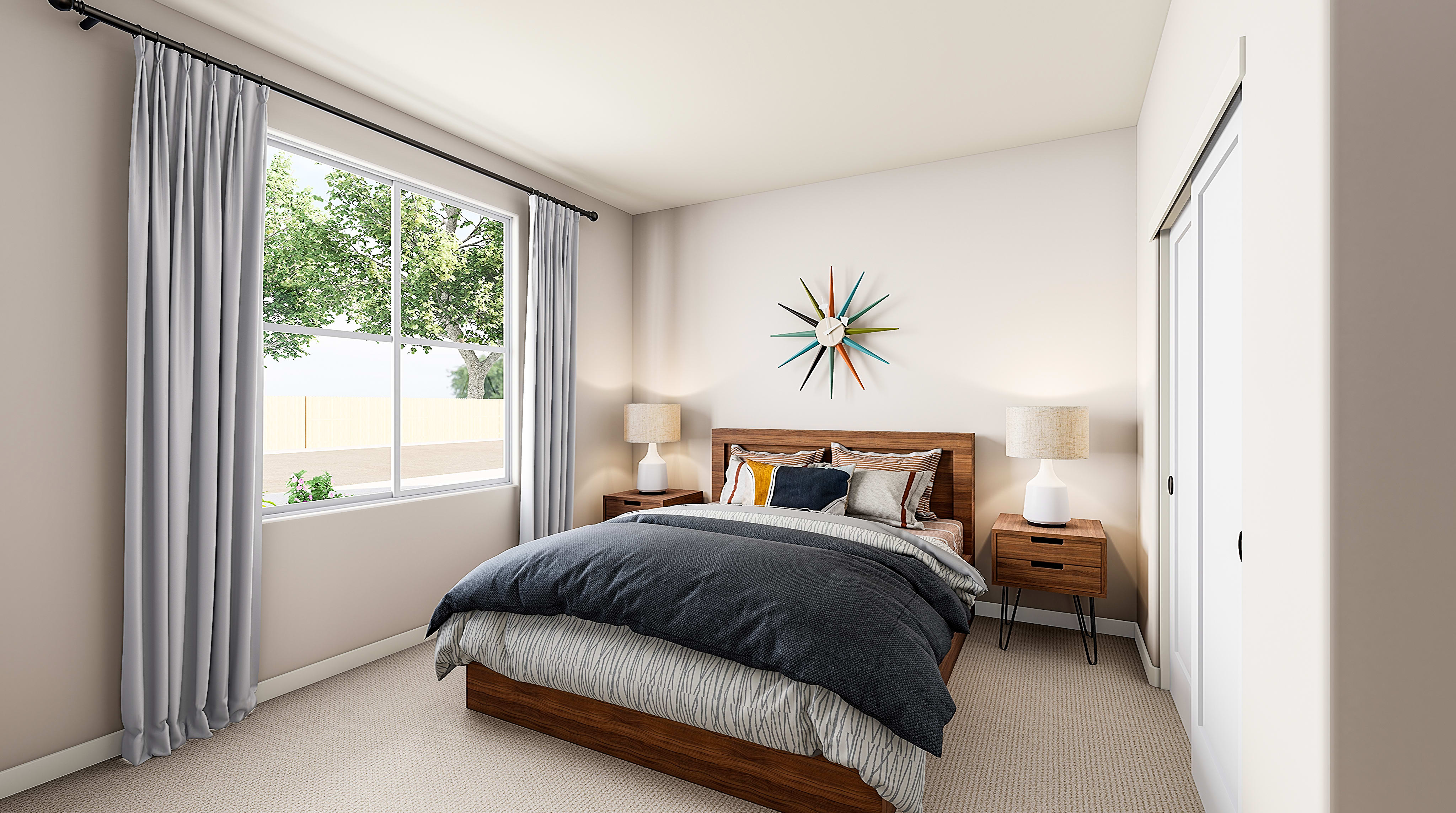 A cozy and well-appointed bedroom with a large window overlooking a lush outdoor scene, featuring a wooden bed frame, plush bedding, and a decorative starburst wall art piece.