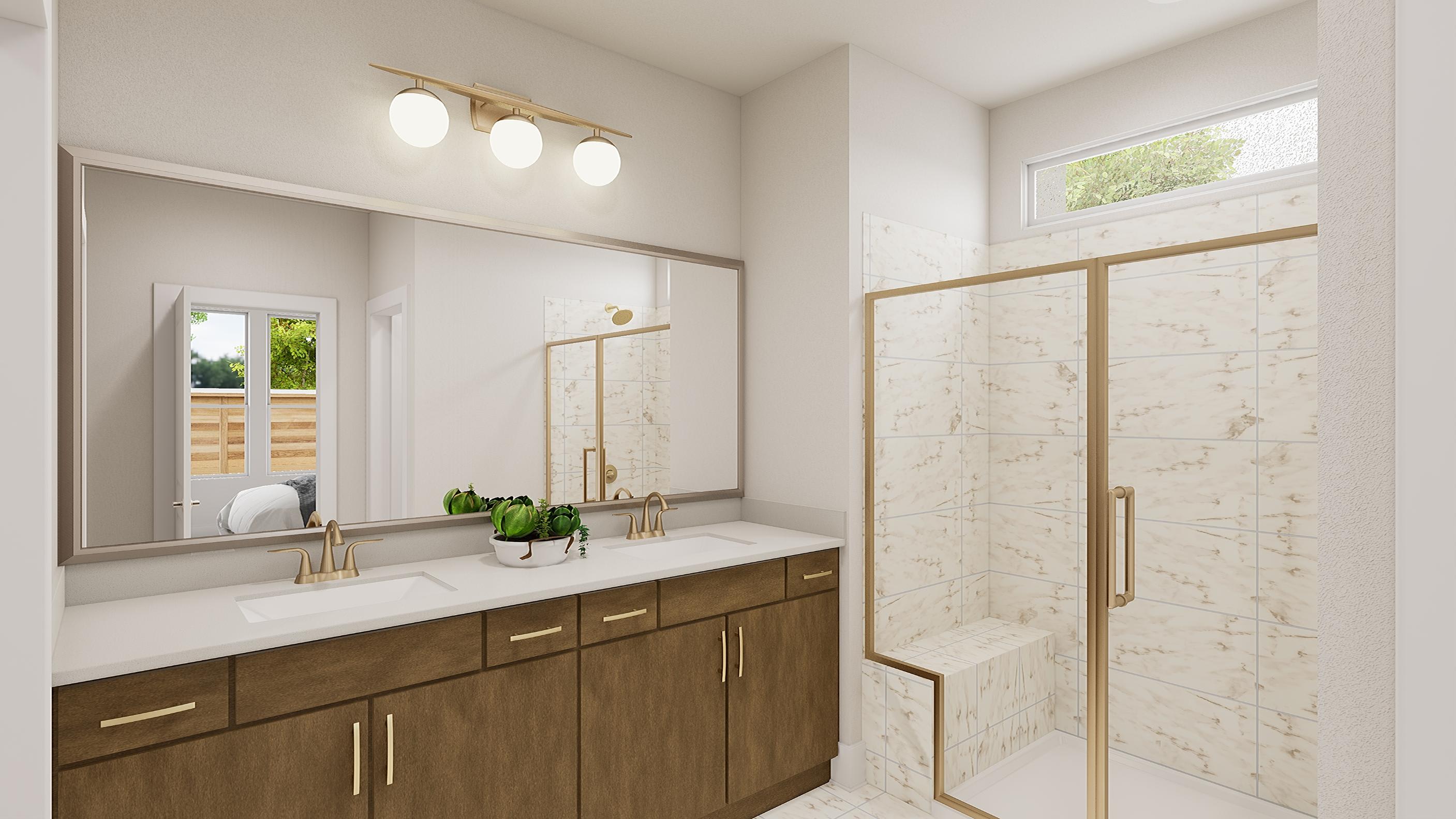 A modern and spacious bathroom with a large vanity, a mirror, and a glass shower enclosure, all bathed in natural light from the window.