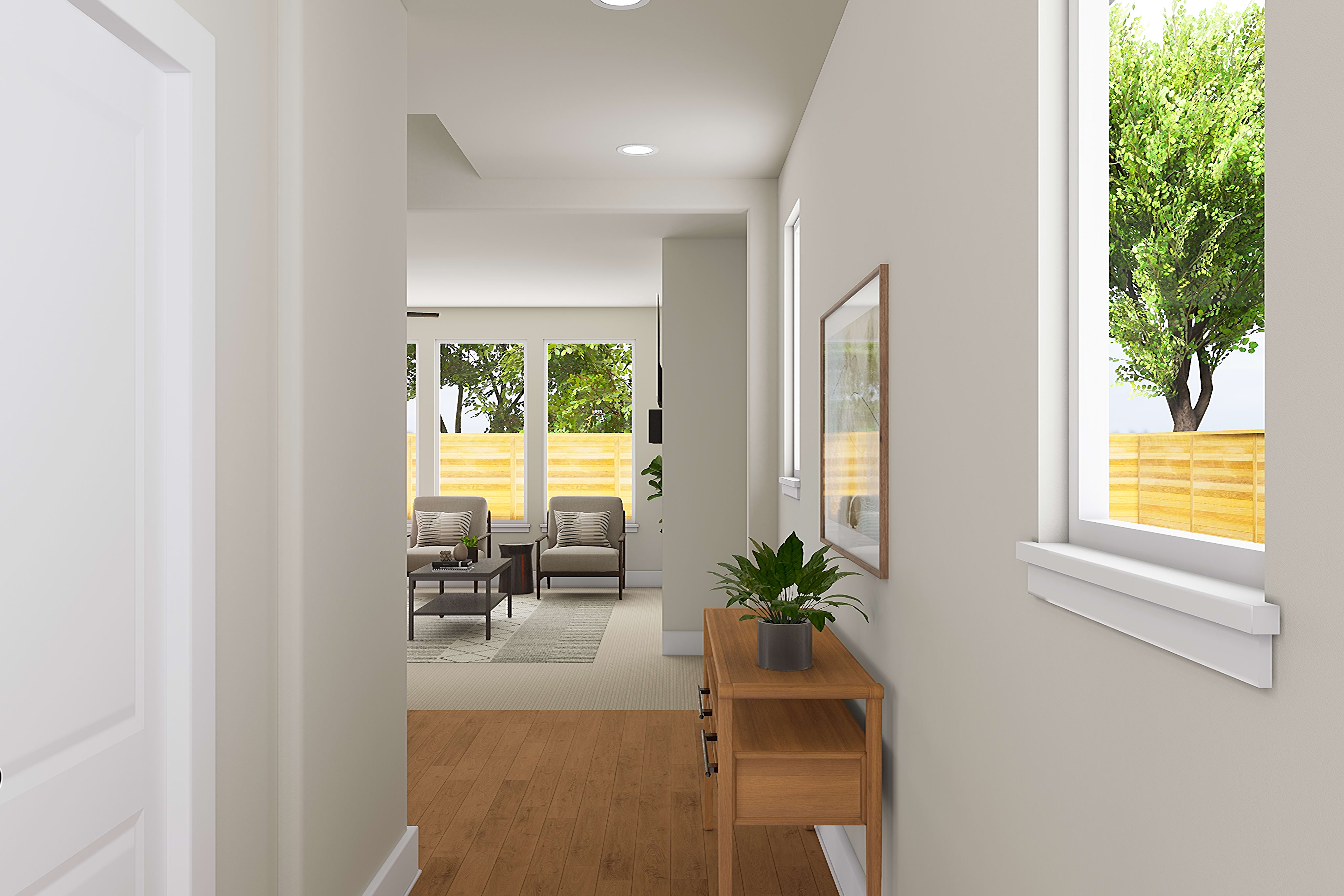 A bright and airy hallway with a wooden console table and a potted plant, leading to a room with chairs visible in the background and a view of the outdoors through the window.