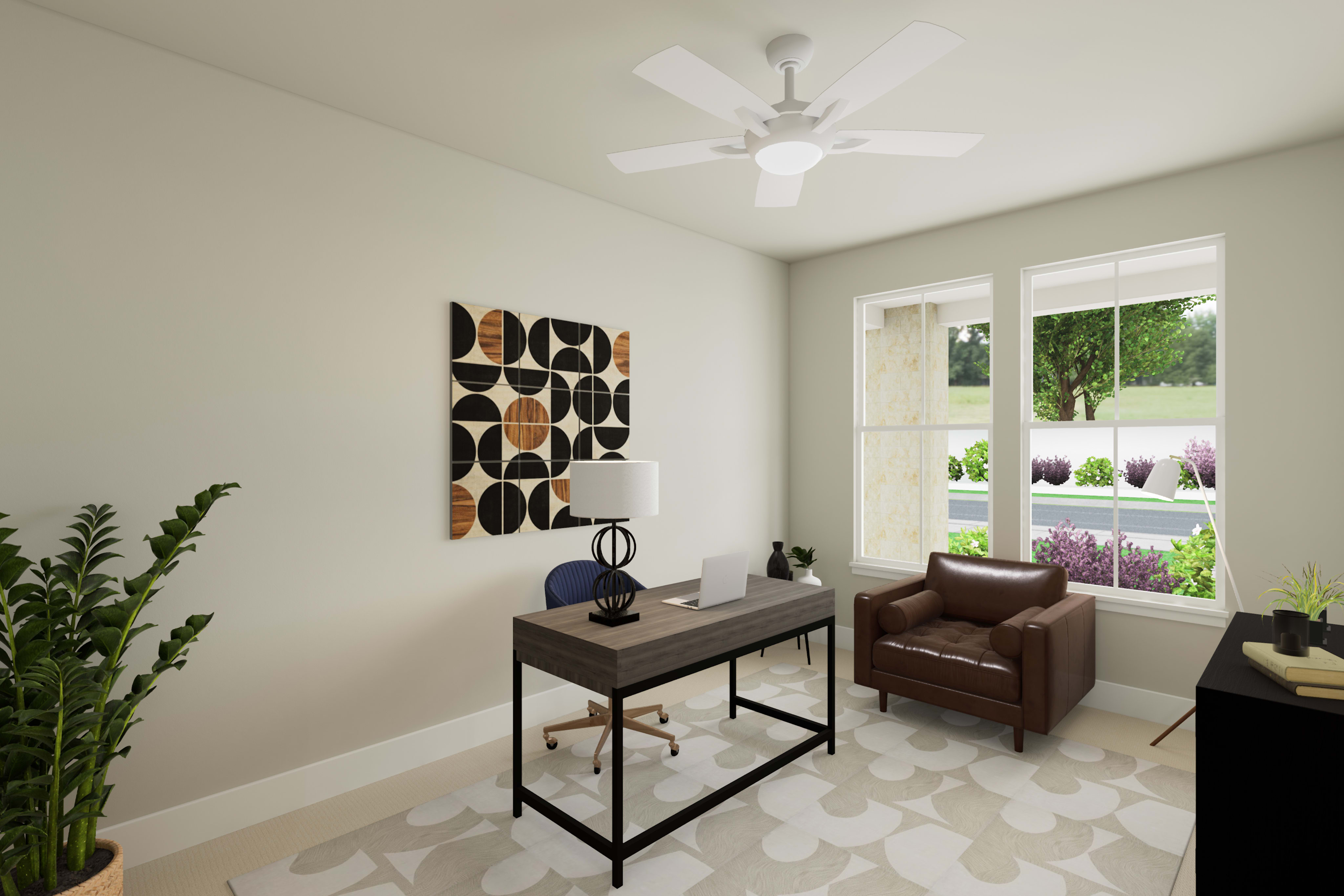 A cozy home office space with a leather armchair, a wooden desk, and a decorative wall art piece, set against a bright and airy backdrop with a ceiling fan and a view of the outdoors.
