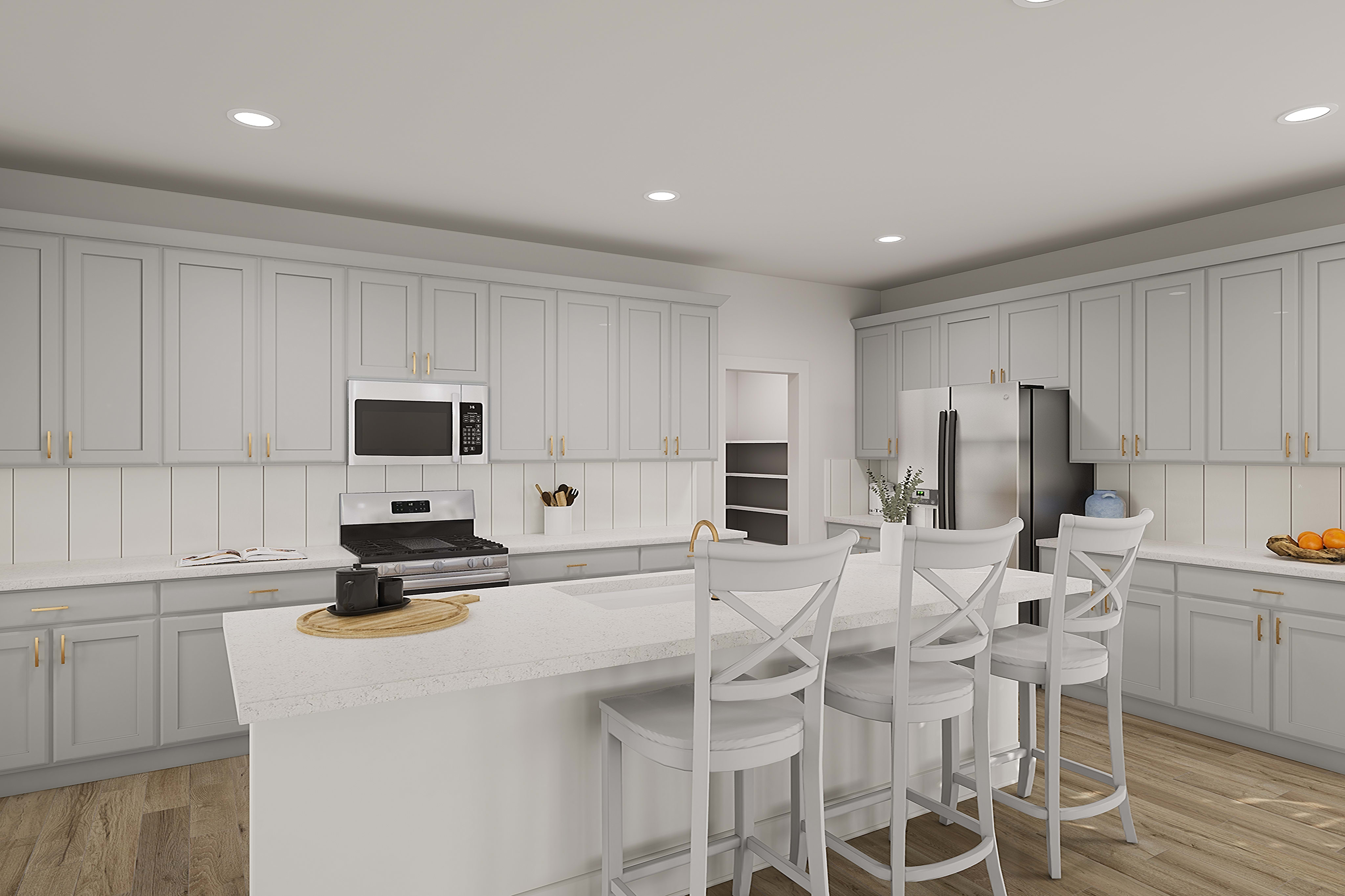 A modern, well-lit kitchen with white cabinets, stainless steel appliances, and a central island with bar stools, set against a hardwood floor.