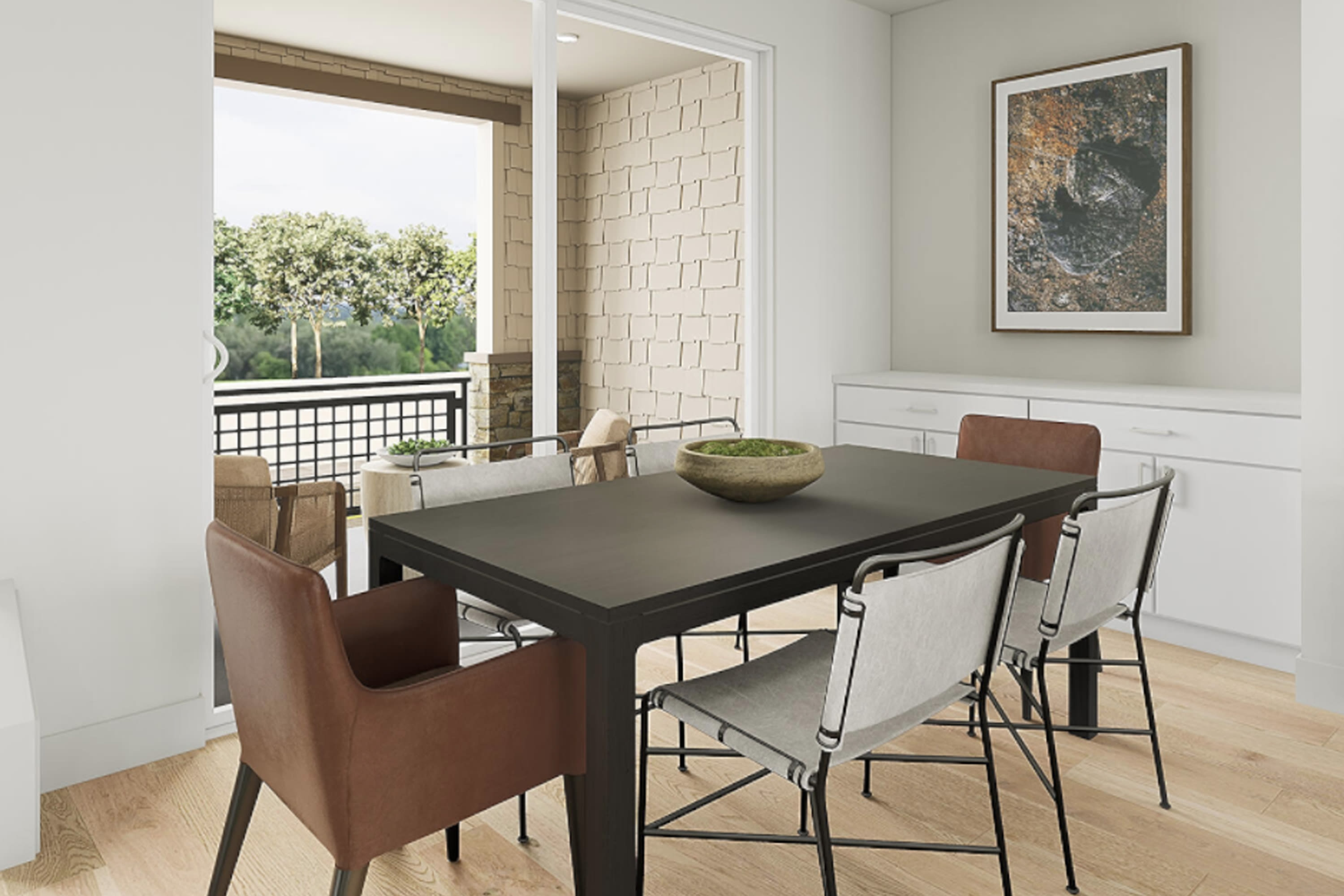 A modern dining room with a dark wooden table, leather chairs, and a large window overlooking a lush outdoor landscape.