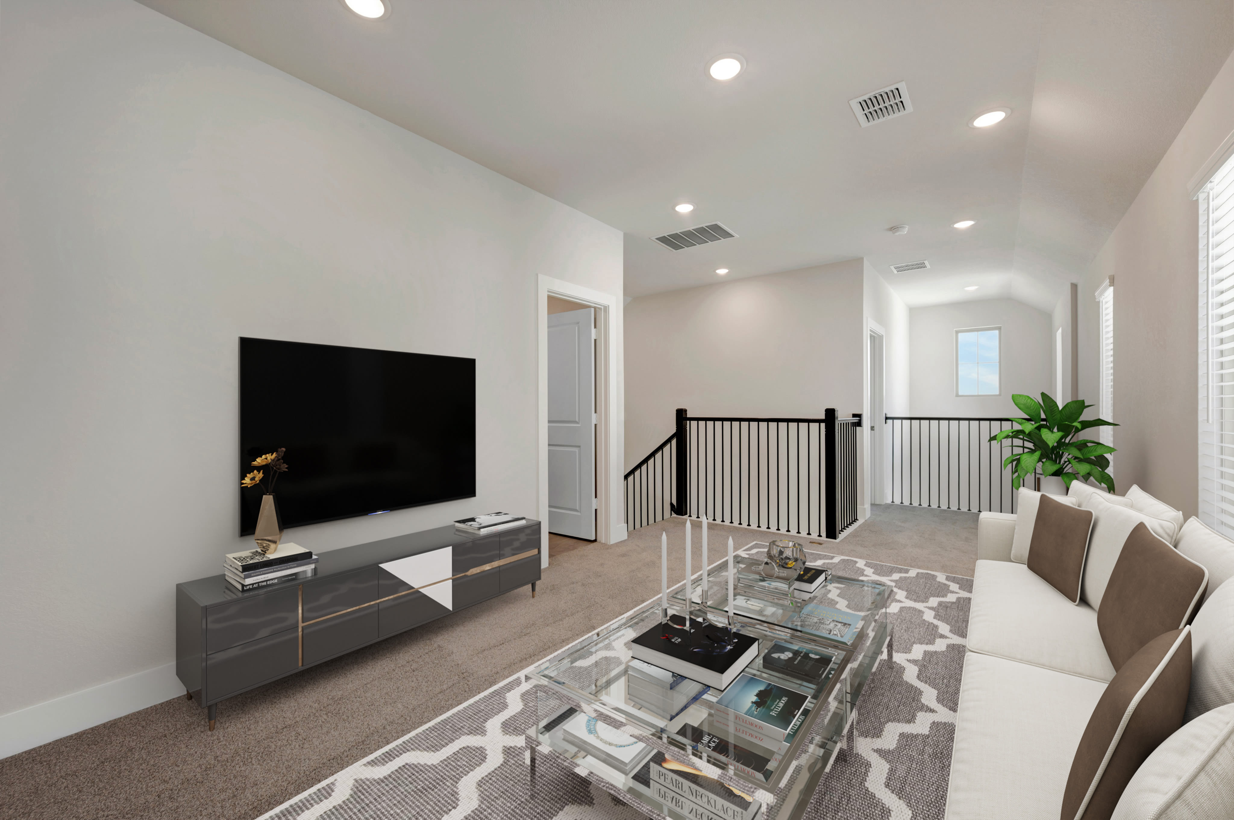 A modern living room features a white sofa and a glass coffee table in the foreground, with a large television on a grey console and a hallway leading to a staircase in the background.