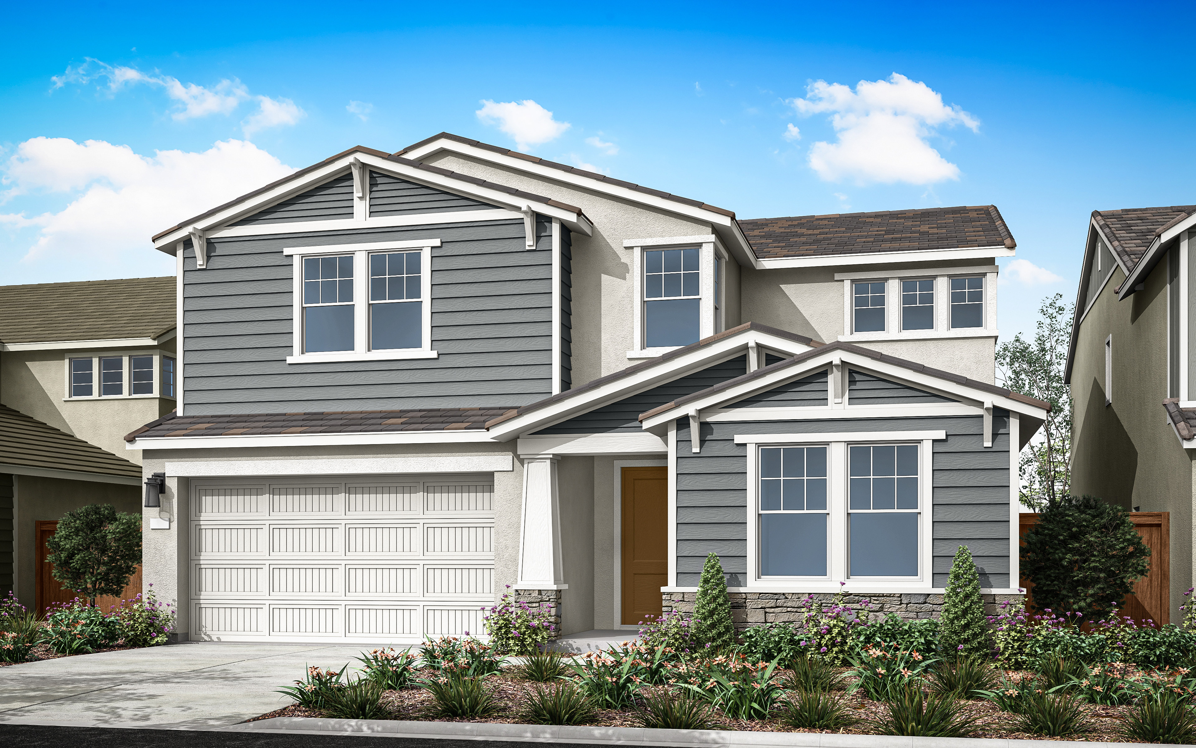A two-story gray house with a garage, surrounded by landscaped gardens and a clear blue sky with fluffy white clouds.