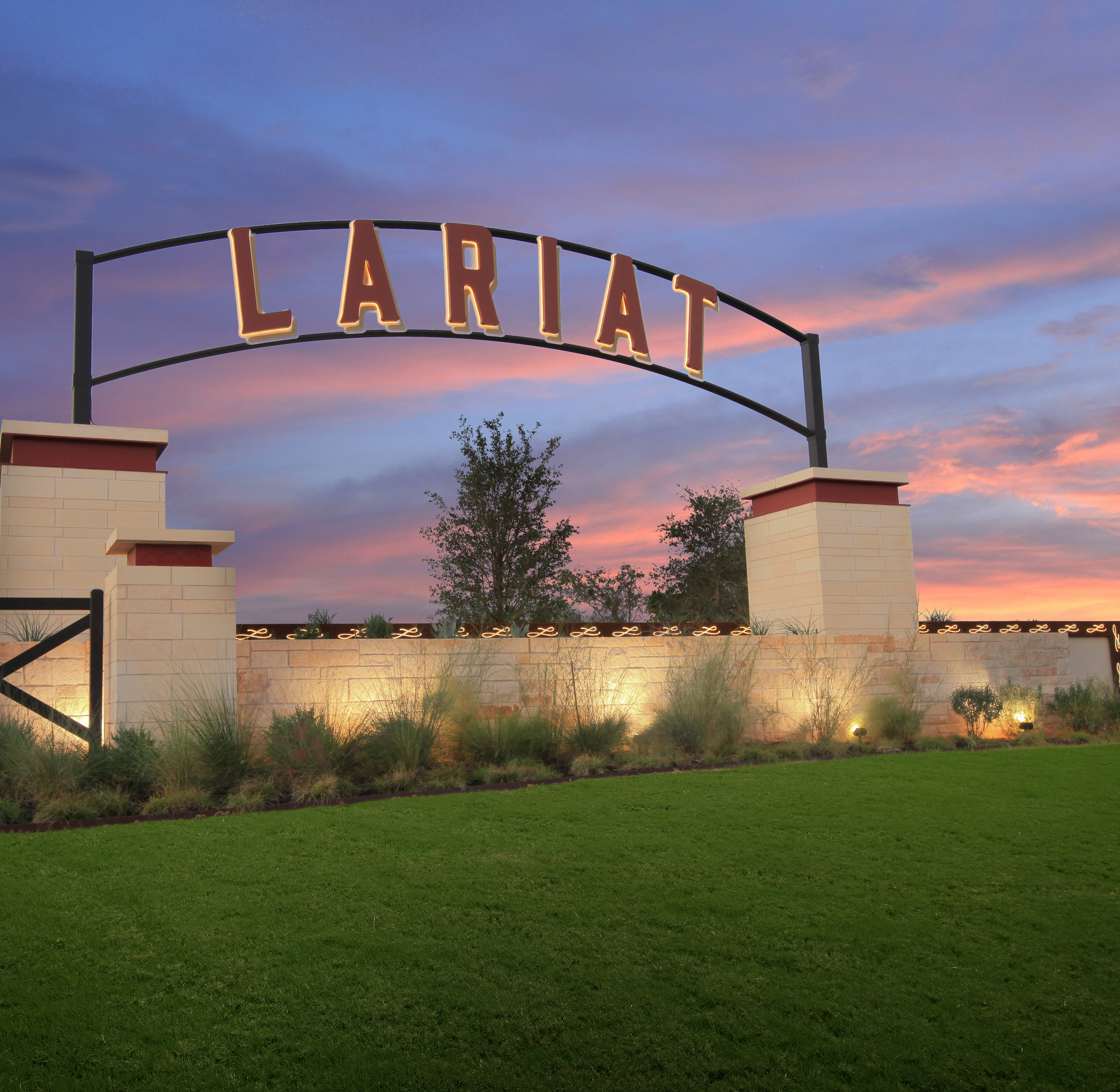 A large archway with the word "Claritin" stands in the foreground, surrounded by a grassy field and a vibrant sunset sky in the background.