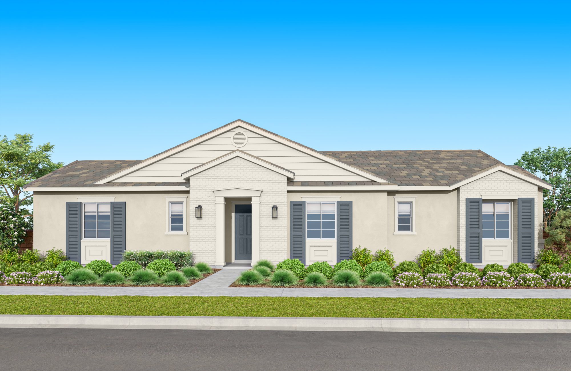 A single-story beige house with a gabled roof, surrounded by lush greenery and a clear blue sky in the background.