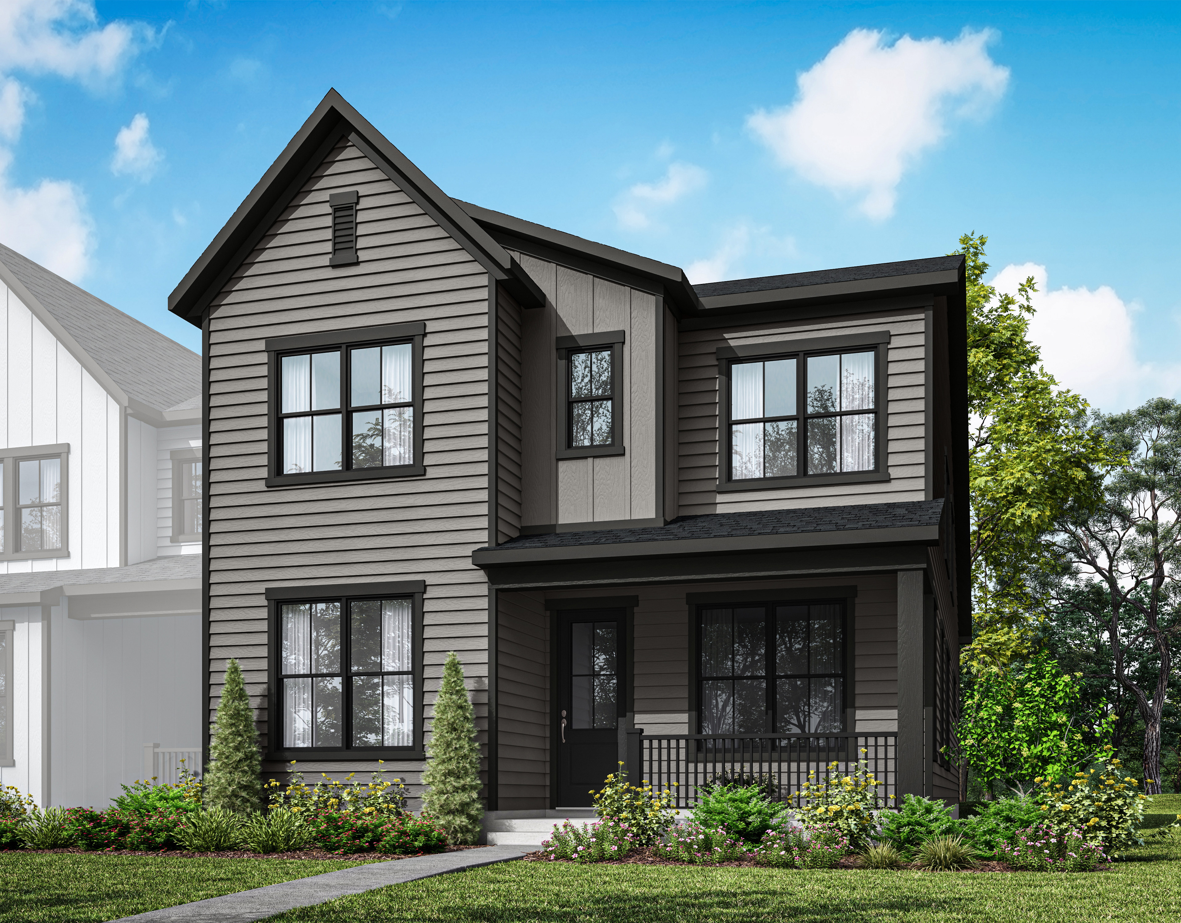 A two-story modern farmhouse with a black exterior, surrounded by lush greenery and a clear blue sky with fluffy white clouds.