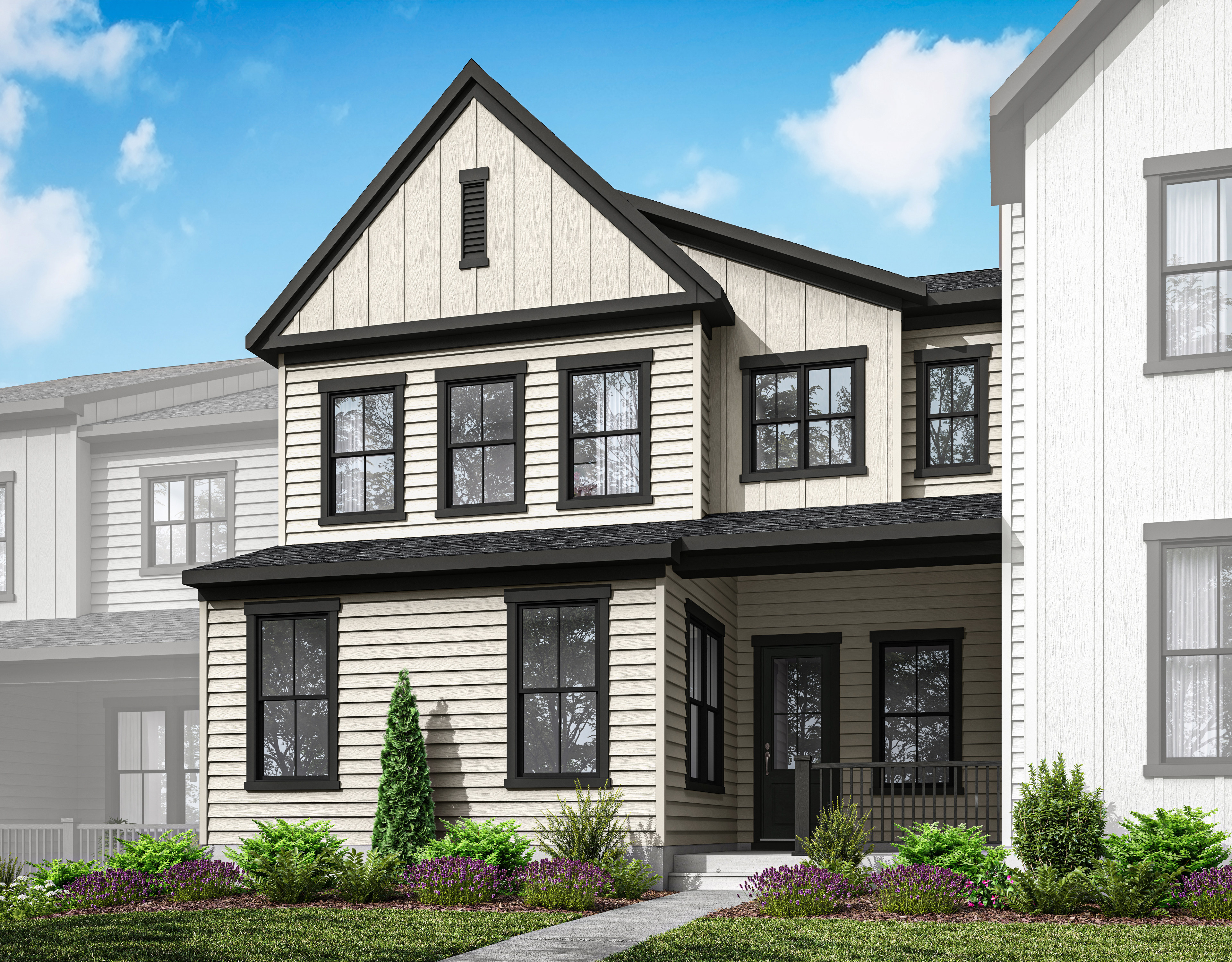 A two-story white and black wooden house with a gabled roof, surrounded by lush greenery and set against a bright blue sky with fluffy white clouds.