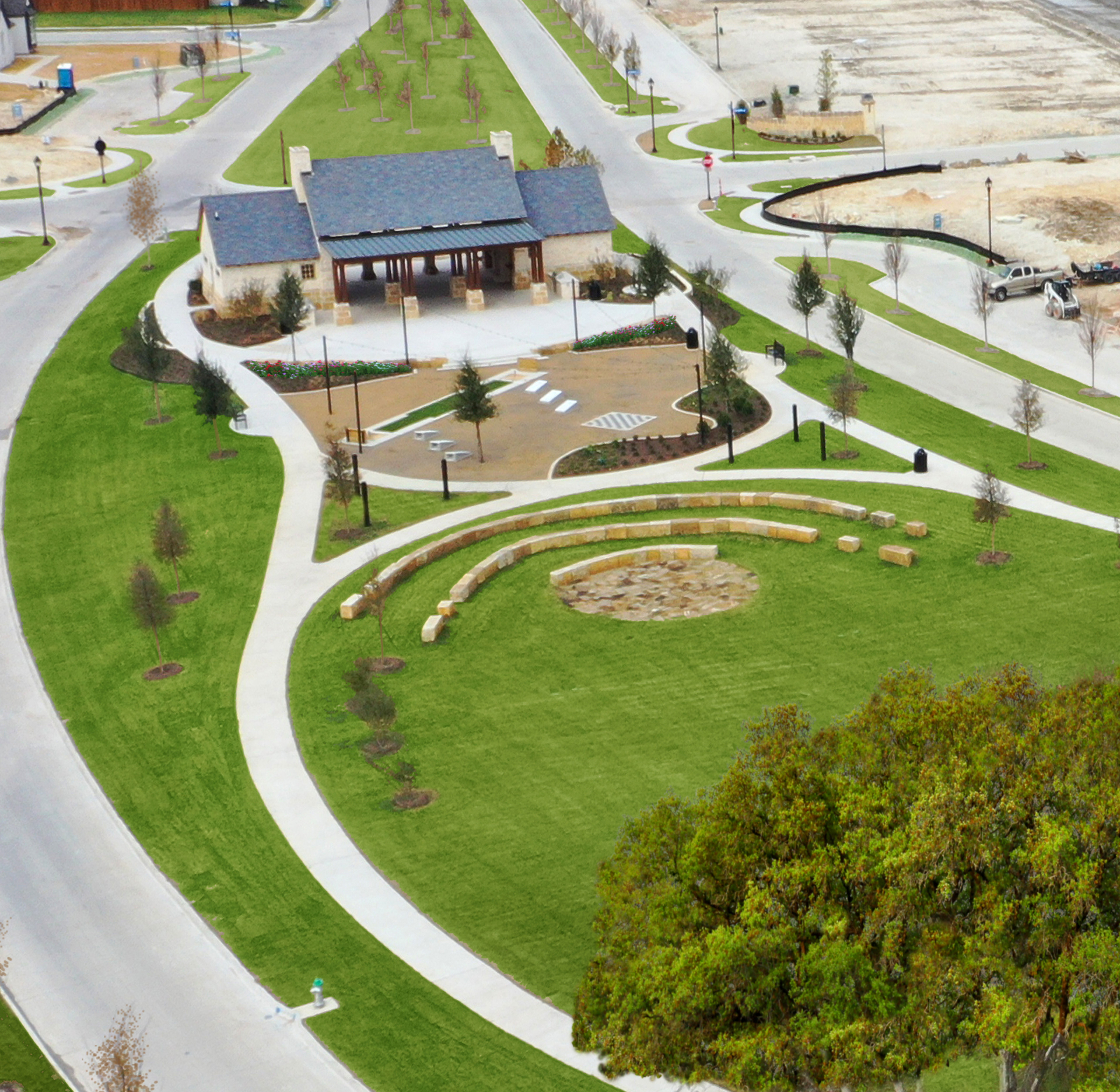 A well-designed residential community with neatly landscaped grounds, winding paths, and a mix of modern and traditional-style buildings nestled in a lush, green setting.