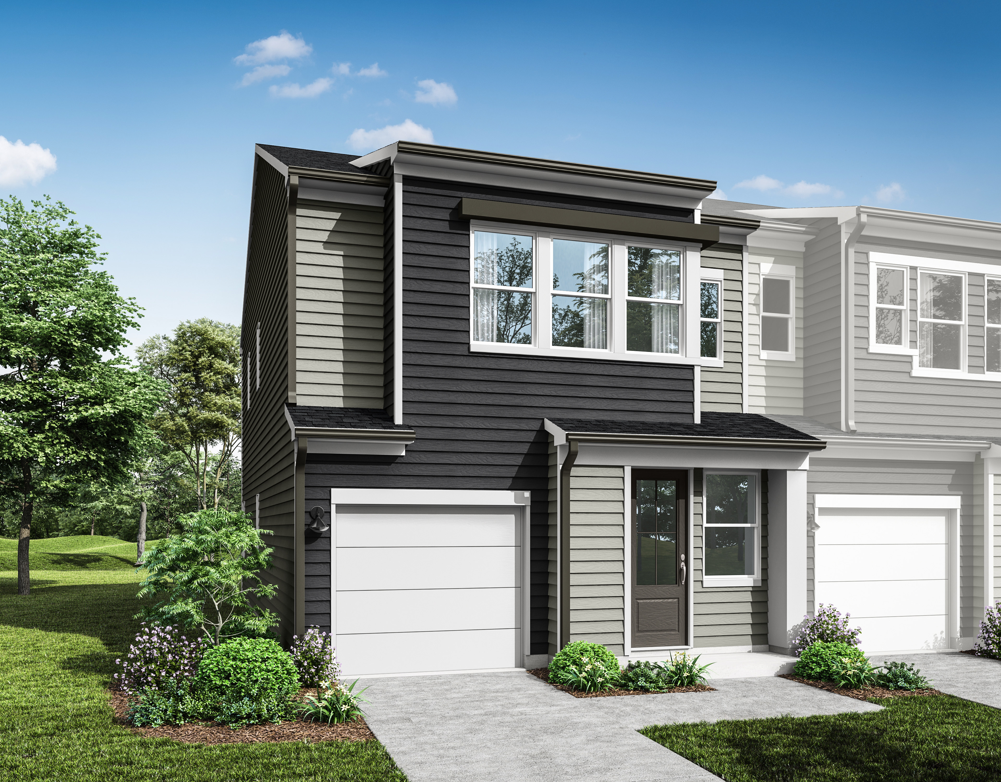 A modern two-story townhouse with a garage, surrounded by lush greenery and a well-manicured lawn in the foreground.