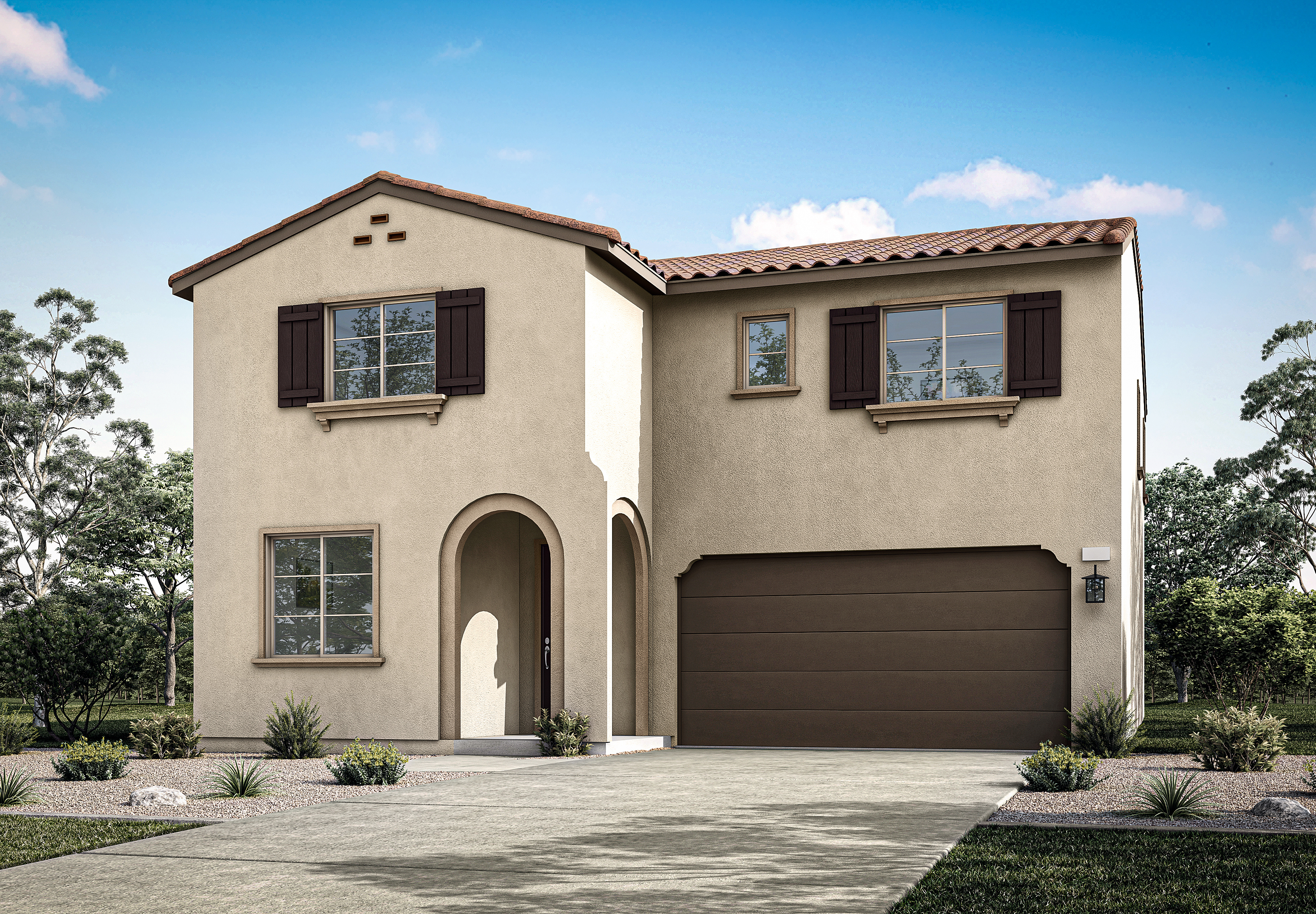 A two-story stucco house with a tiled roof, a garage door, and a paved driveway, set against a backdrop of lush greenery and a clear blue sky.