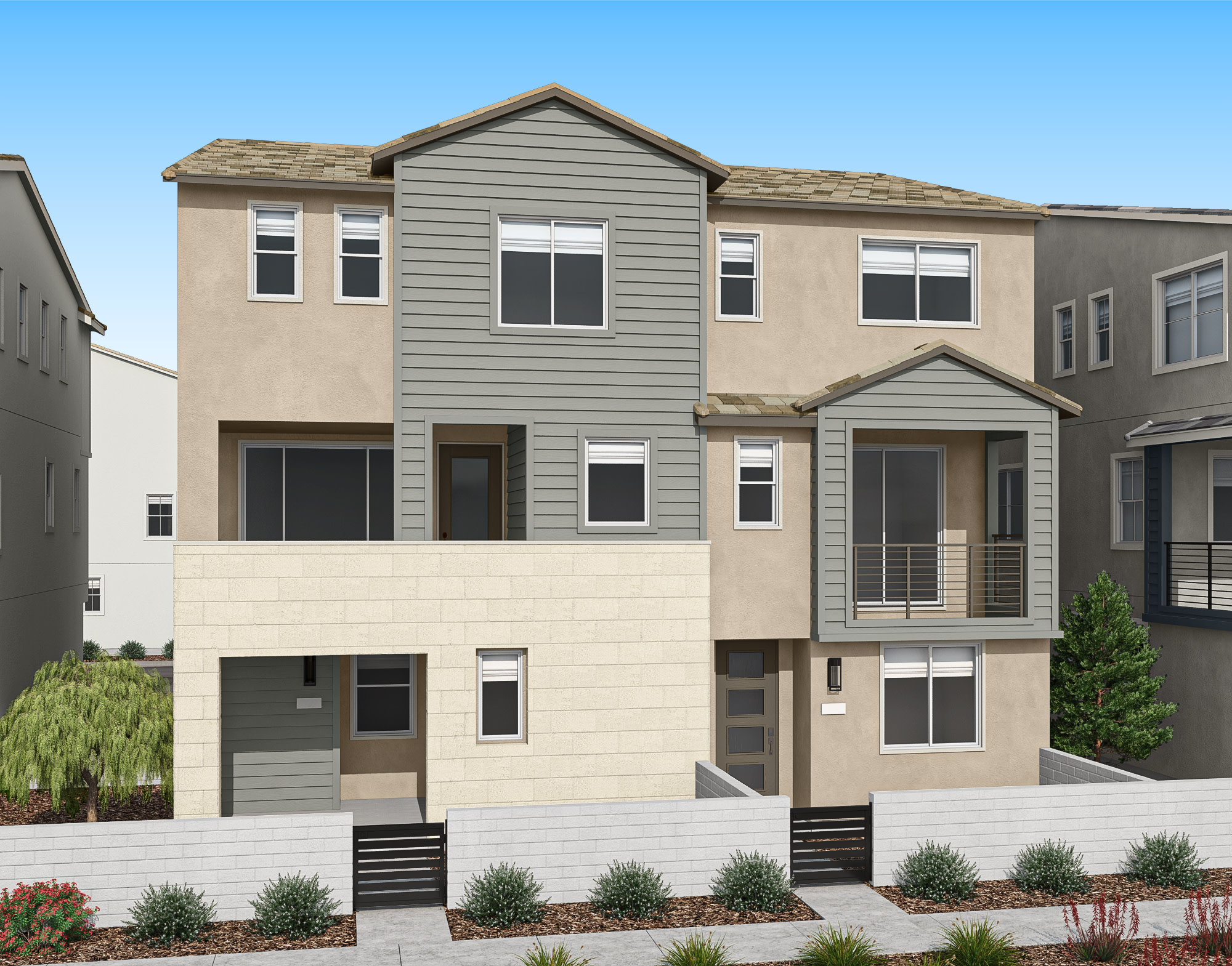 A multi-story residential building with a gray exterior, surrounded by landscaping and a clear blue sky in the background.
