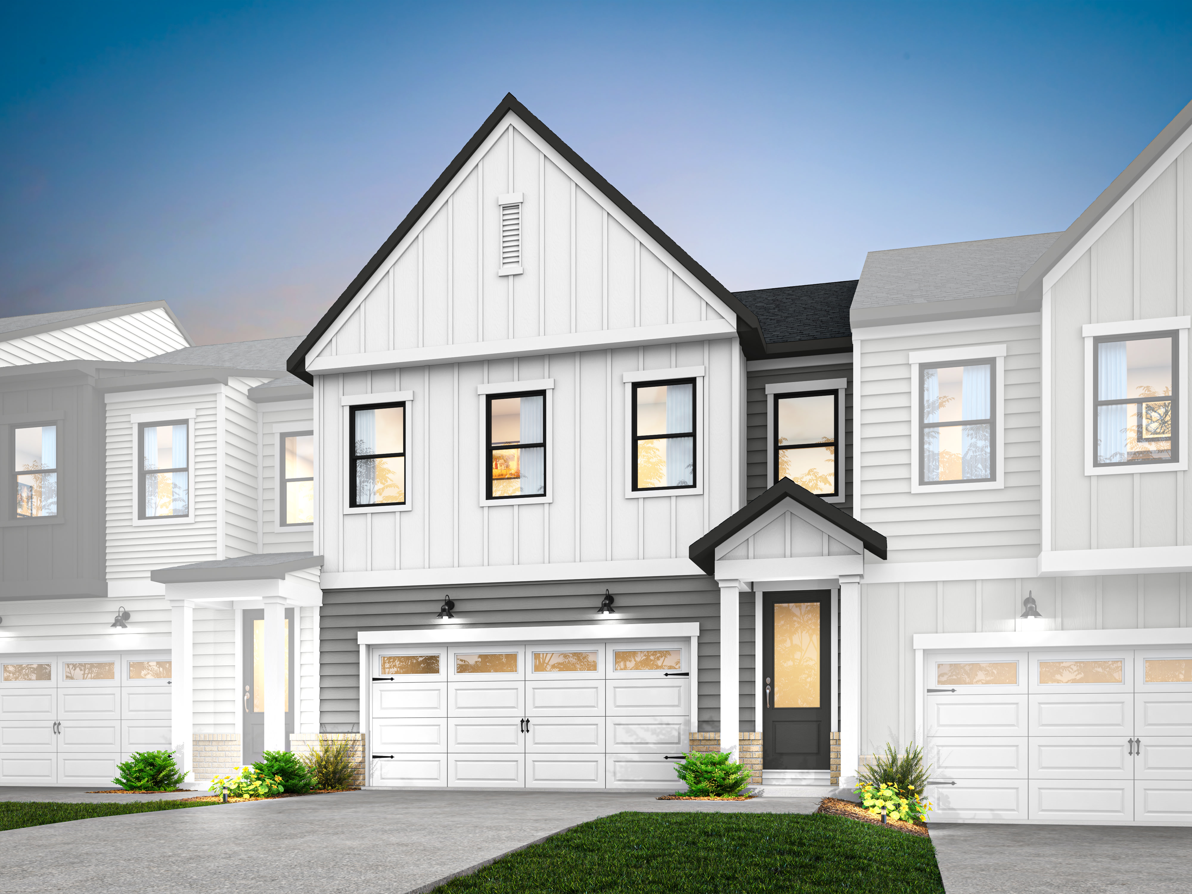 A modern, two-story townhouse with a white exterior, black trim, and a prominent gable roof stands in the foreground, surrounded by a well-manicured lawn and landscaping.