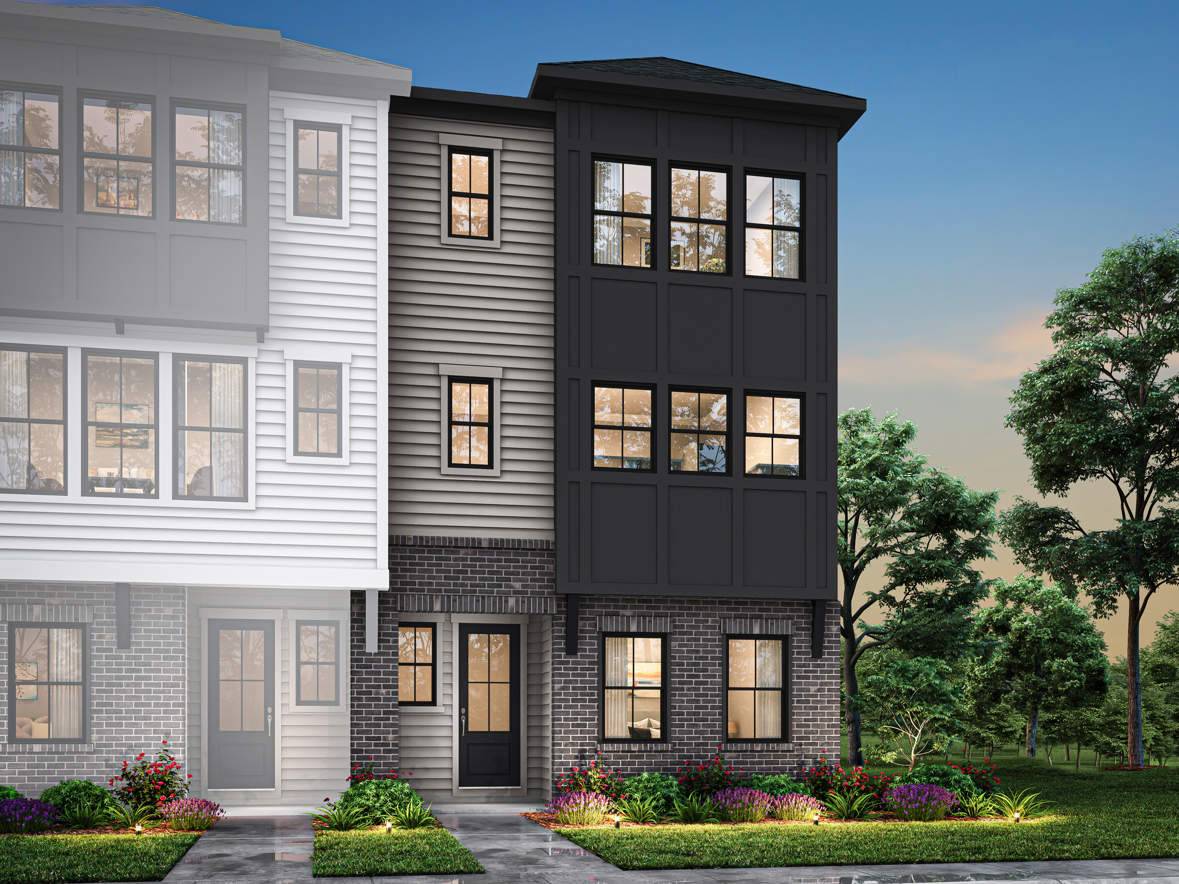 A modern, multi-story townhouse with a mix of white siding and black accents, surrounded by lush greenery and landscaping in the foreground.